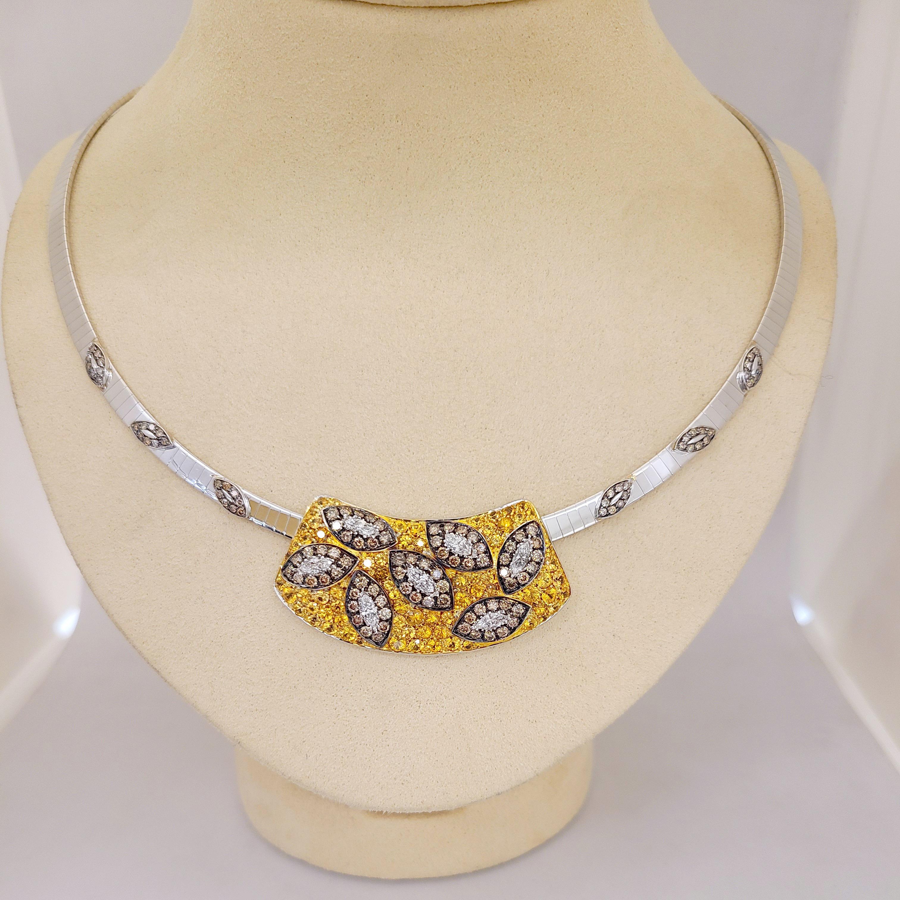 This stunning pendant  necklace was crafted by Italy's renowned Carlo Barberis known for his creativity and elegant touches of fantasy. Set in 18 karat white gold the yellow sapphire pendant is set with brown and white diamond leaves. The stationary