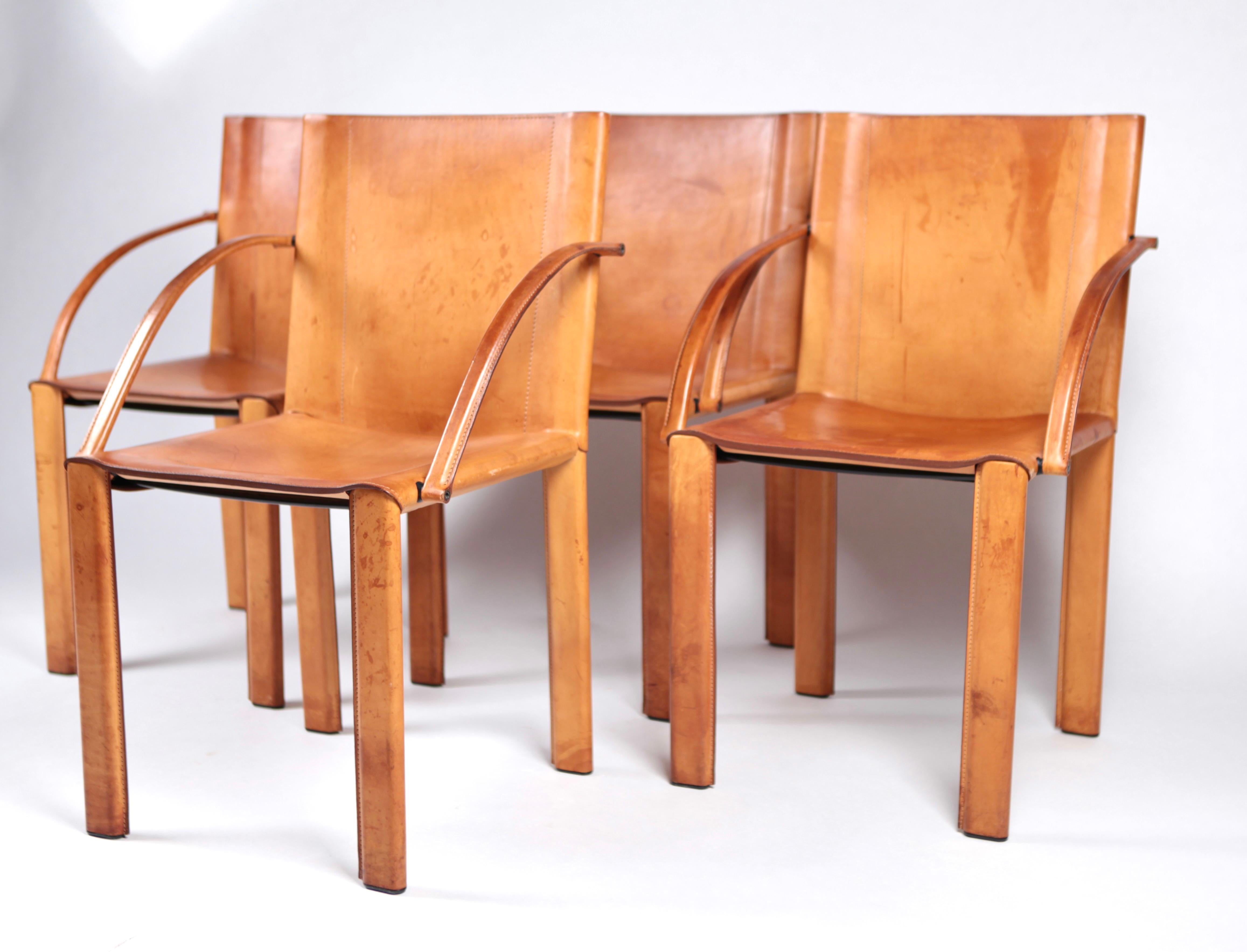 The set is in excellent vintage condition. The leather has some stains due to it's wear and some scratches, but overall a great patina and color.
The chairs are manufactured by Matteograssi, Italy in 1980, and designed by Carlo Bartoli. The full