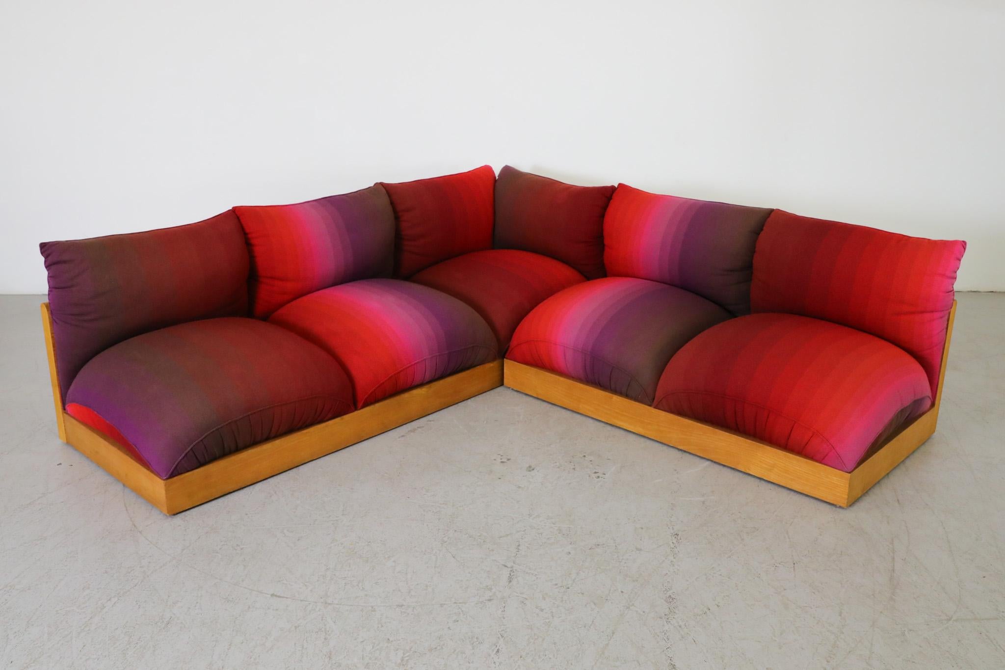 Carlo Bartoli for Rossi di Albizzate sectional sofa, model ‘Down’, 1973 with gorgeous rounded oak frame and spectral striped textile in reds and purples. This stunning sofa has two sections, a 2 seater with no arms and a 3 seater with right arm. Can