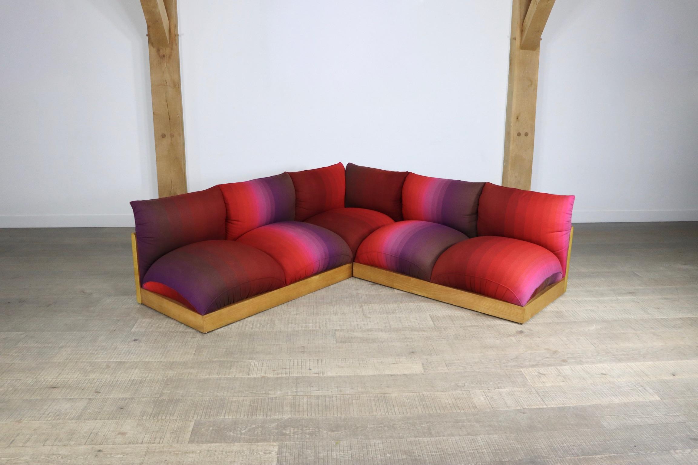 Unique sectional sofa model 'Down' by Carlo Bartoli for Rossi di Albizzate in a bold original upholstery in a spectrum of red to purple colours. This ultimate seventies sofa is made of an oak wooden base with large cushions hooked into it. The large