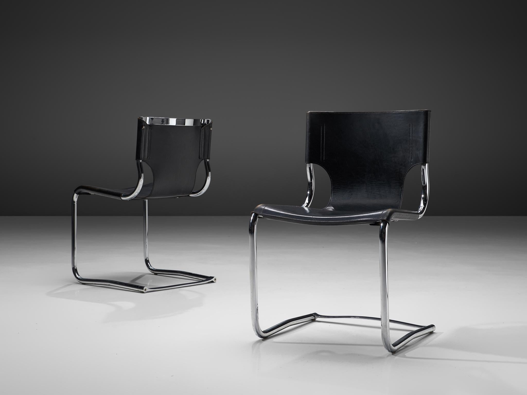 Carlo Bartoli, pair of dining chairs model '920', black leather, steel, Italy, designed in 1971. 

This elegant pair of cantilevered tubular frame chairs is executed with the finest black leather that is used as a shell for both seat and back. The