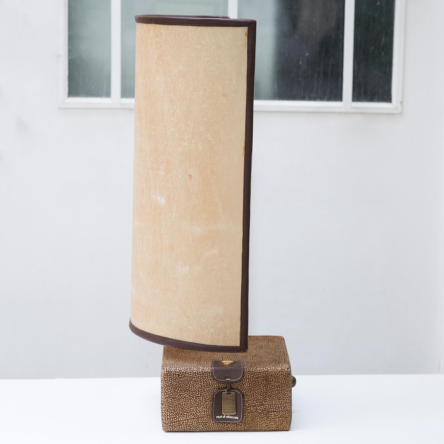 Very elegant suede table lamp with a leather faced parchment shade from the 1980s, BOGO collection of Rossi di Albizzate, designed by Carlo Bartoli.

  