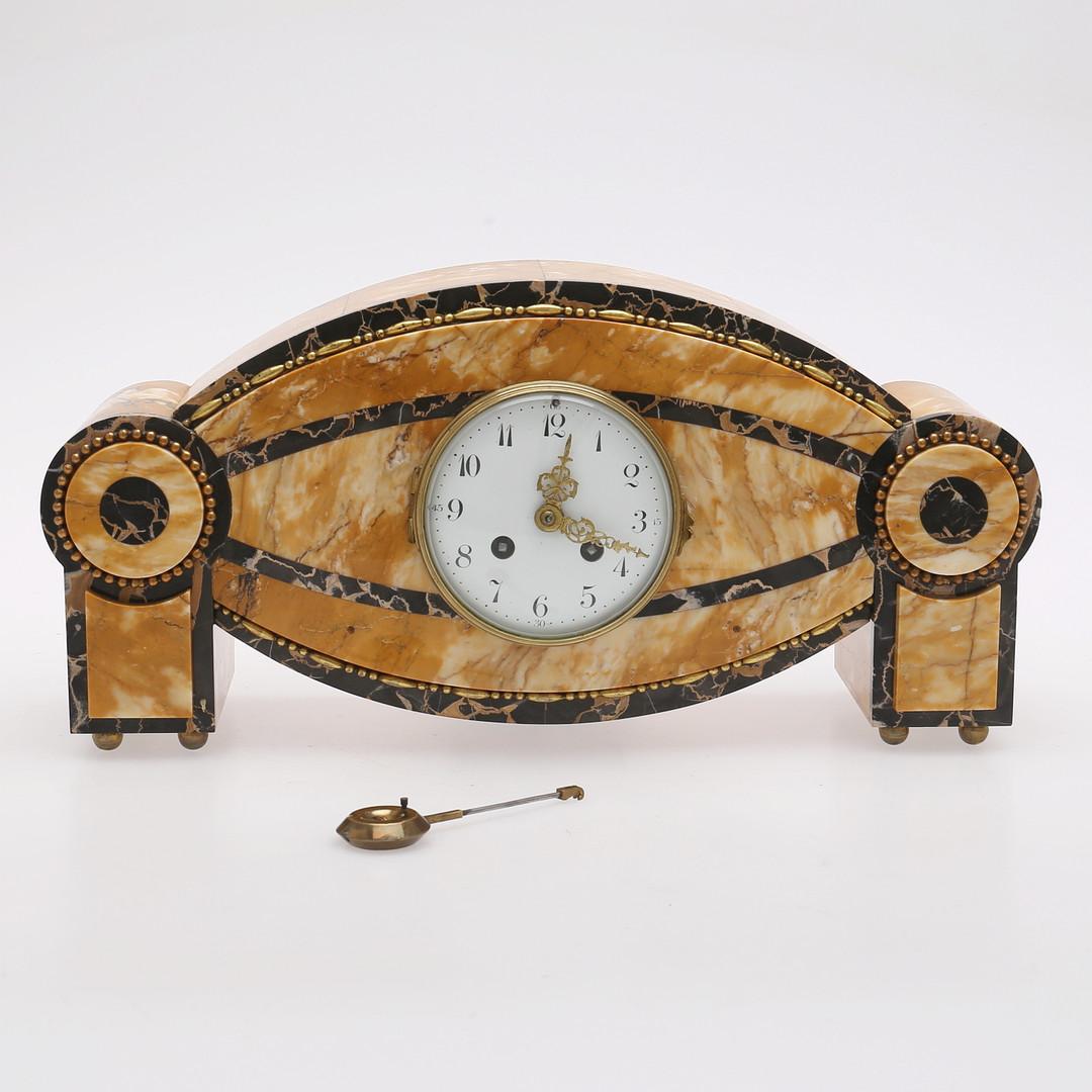 French Art Deco marble mantel clock in the style of Carlo Bugatti in original condition. France, first half of the 20th century, measures: length 42 cm.
Original condition.