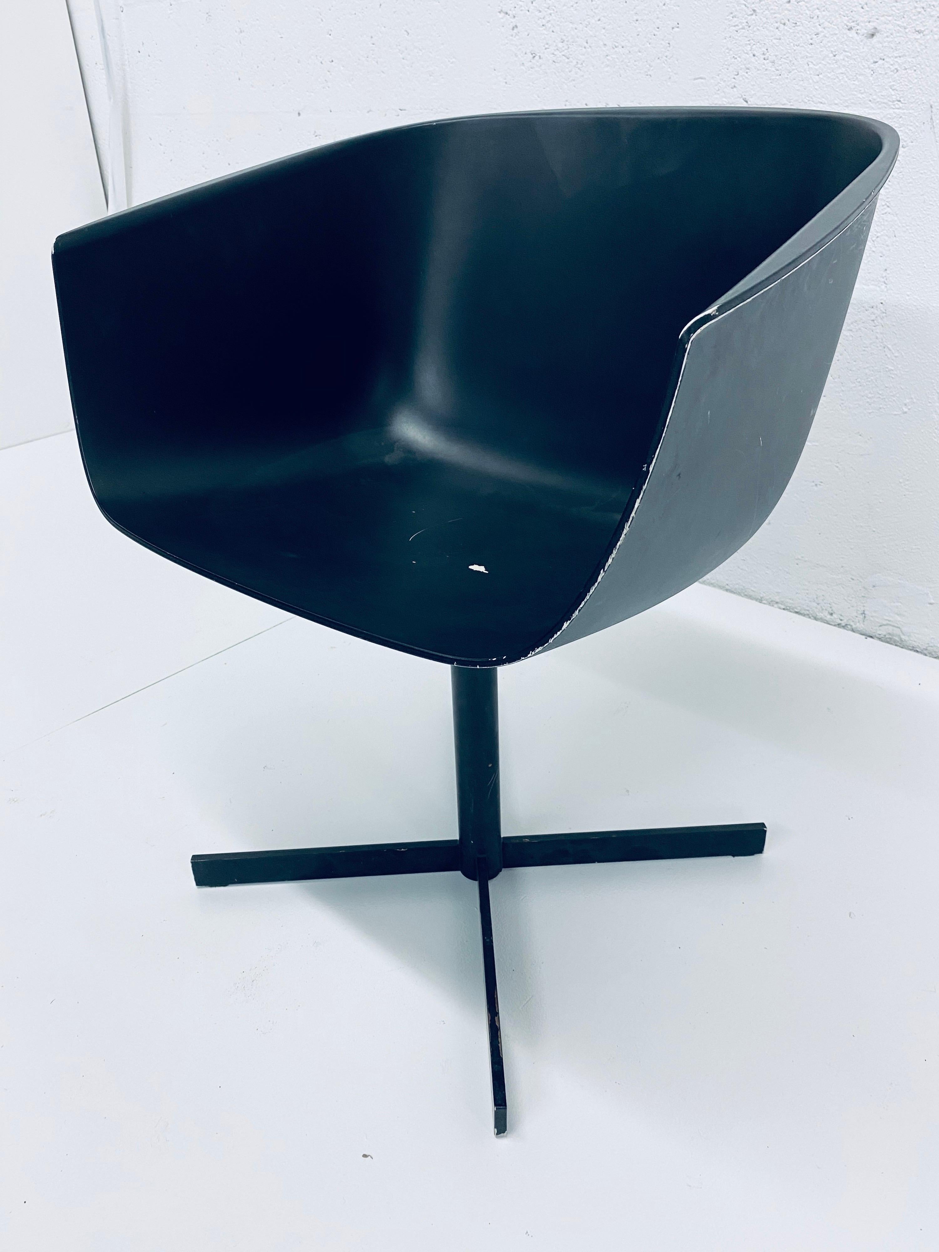 Carlo Colombo designed strip chair made of moulded plastic seat and steel swivel frame for Poliform. Chair is distressed from age and use.