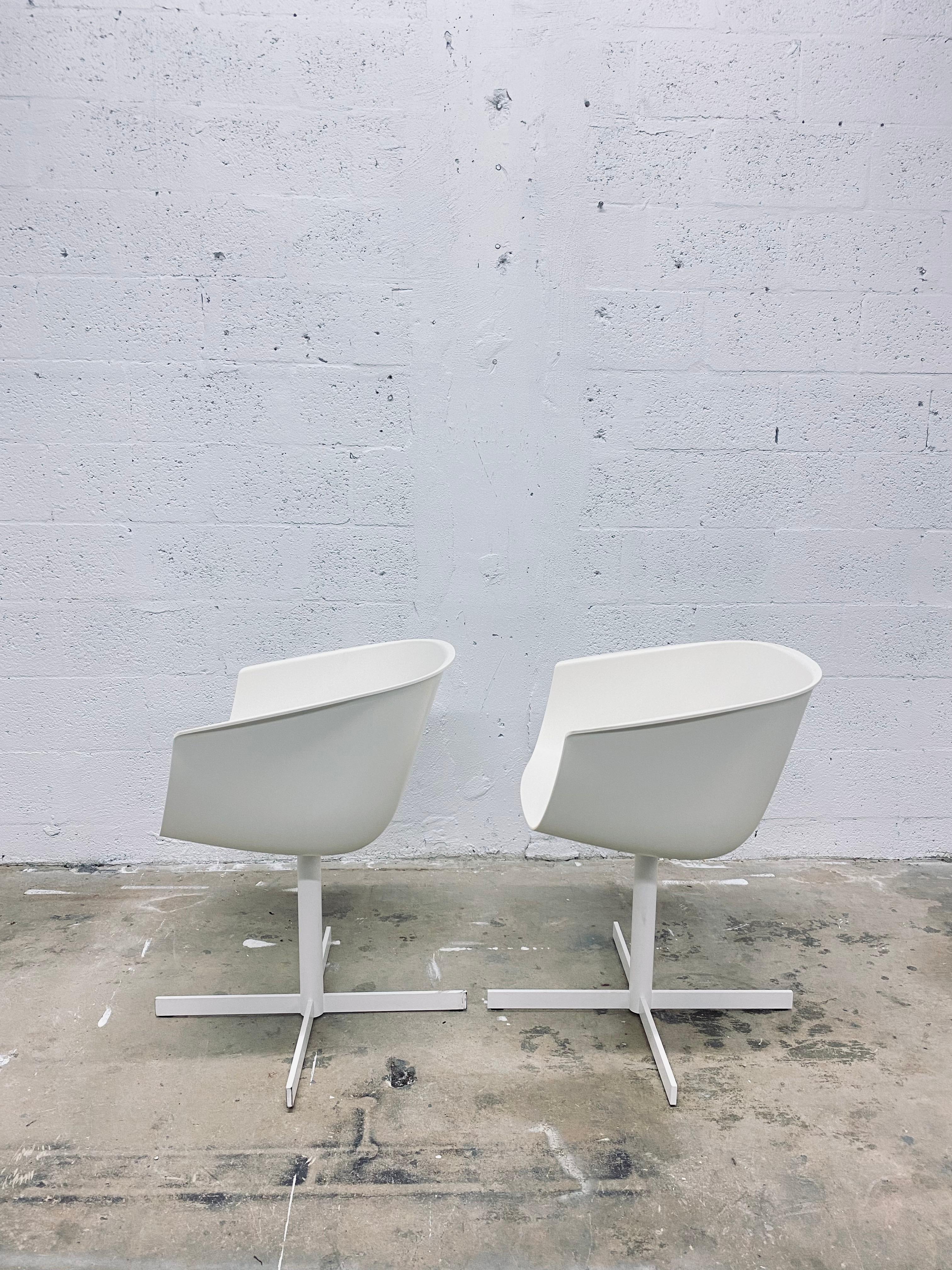 Carlo Colombo designed Strip dining or side chairs made of matte white moulded plastic seats and steel swivel frame for Poliform.