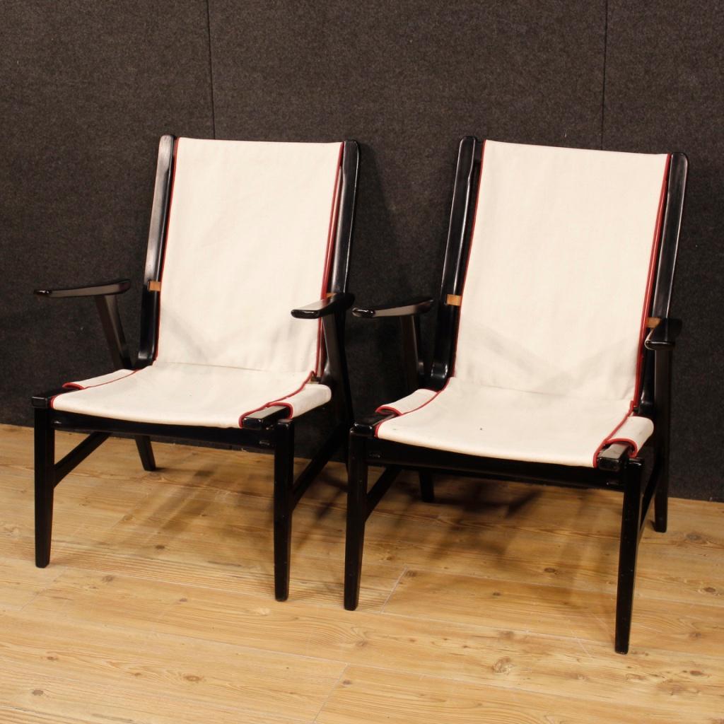 Pair of Italian design armchairs from the 1960s-1970s. Furniture of particular shape and construction in wood and fabric, removable in two elements. Design armchairs attributable to Carlo de Carli missing stamps or signature. Furniture of discreet