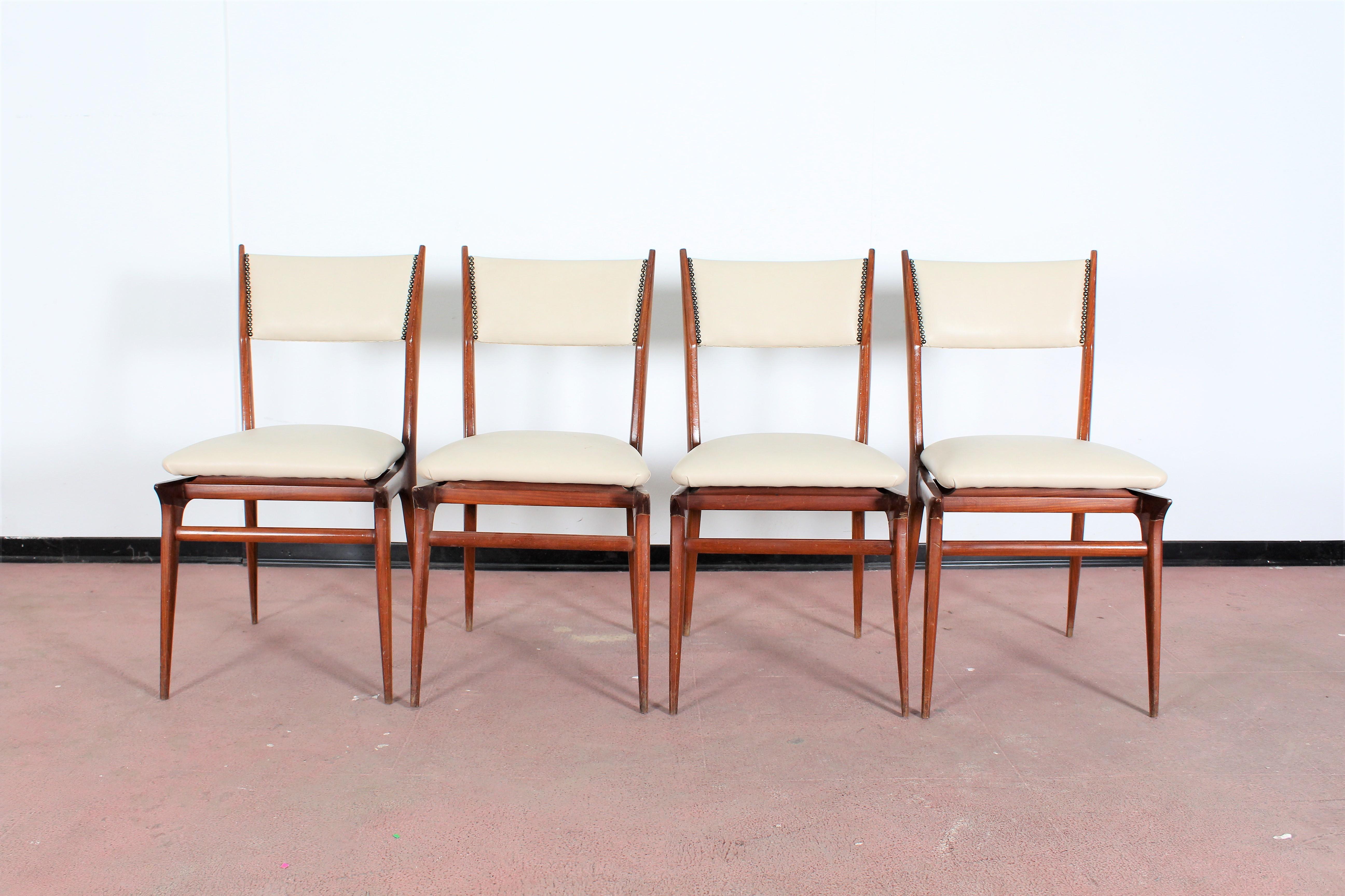 Wonderful set of four wood and leatherette chairs Carlo de Carli, Italy 1950s .
Wear consistent with age and use.