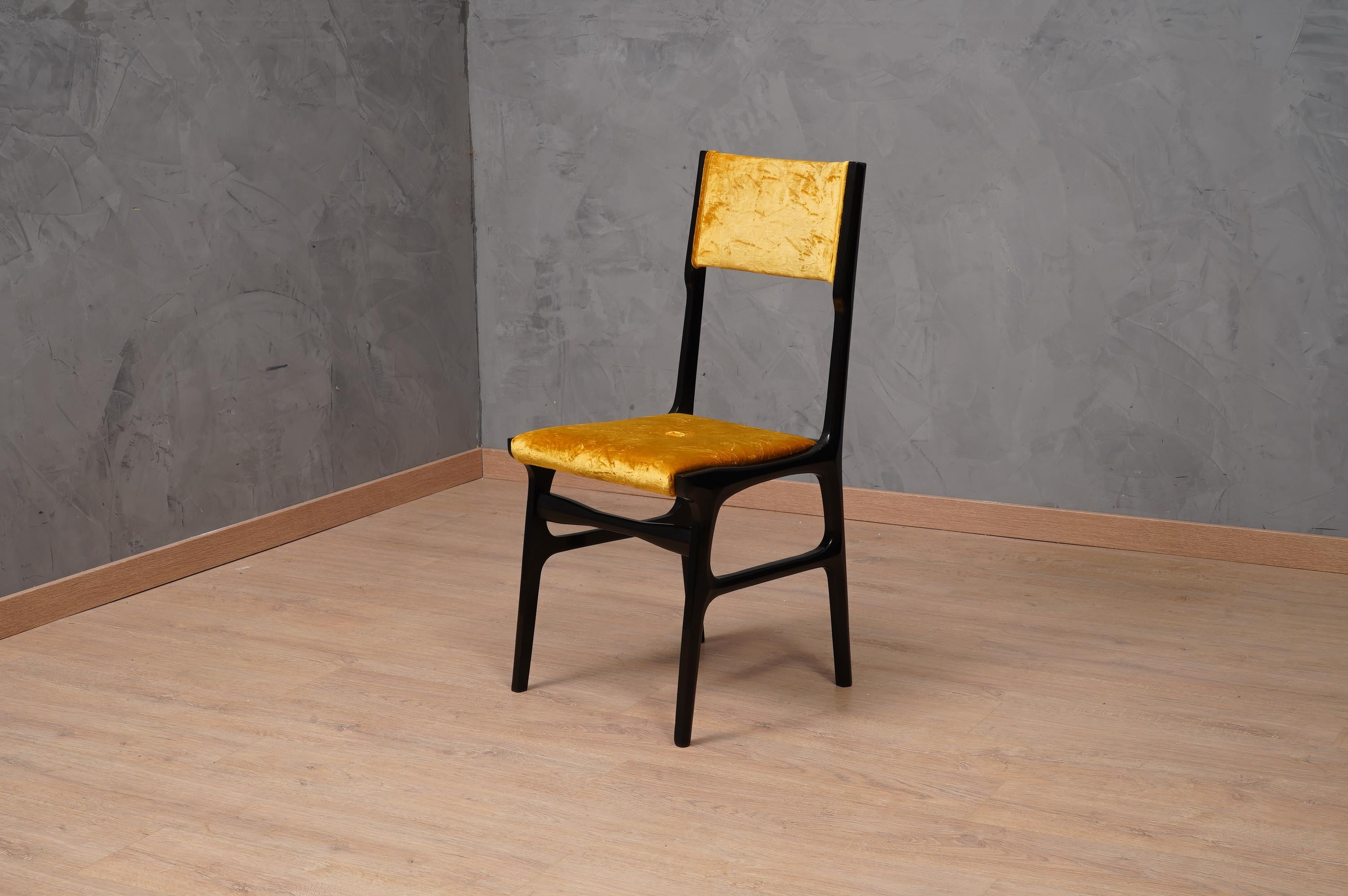 Six chairs attributed to Carlo de Carli 1955, recognizable by their very special design, in the rigorous style of Carlo De Carli.

All in wood polished in black shellac. The backrest and the seat have been upholstered in crumpled yellow velvet.