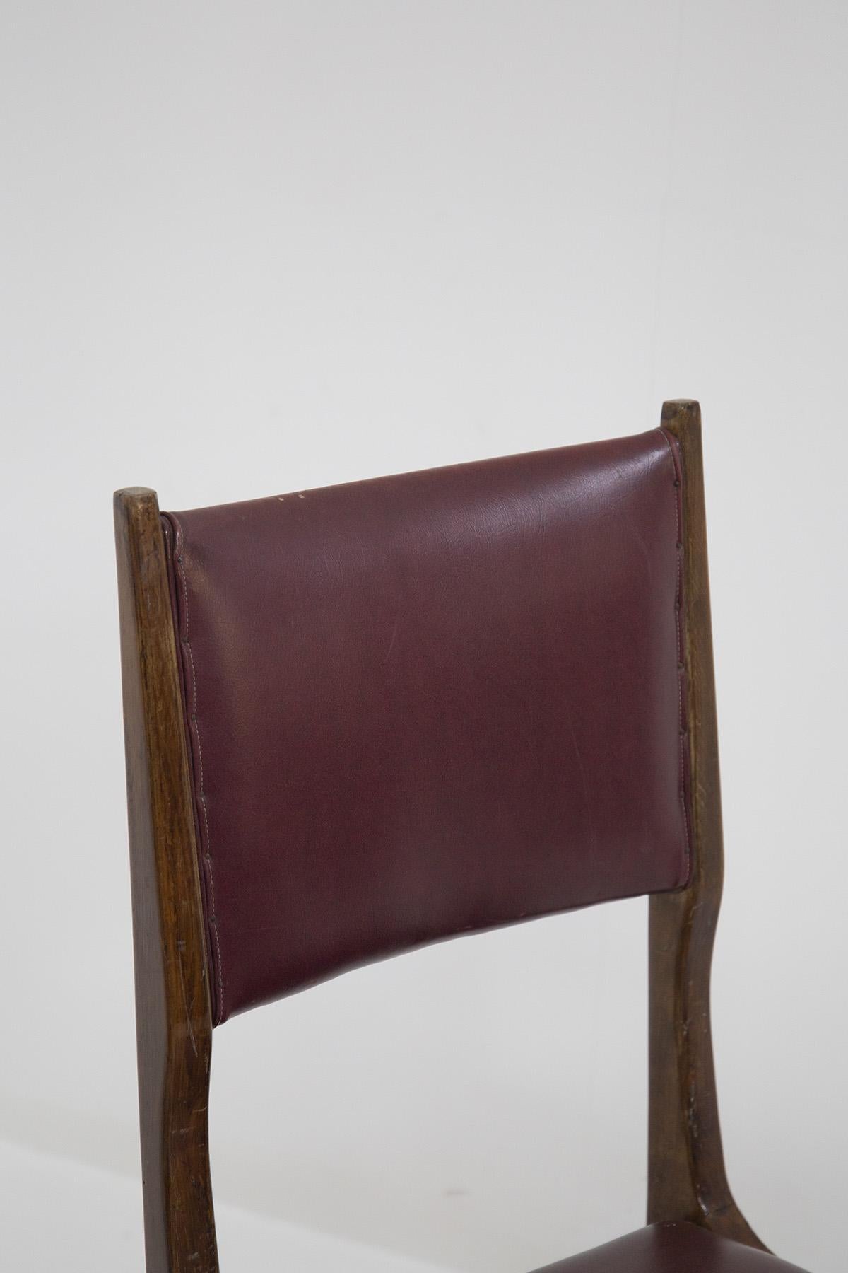 The set of vintage chairs from the ‘50s are designed by Carlo de Carli and made by fine Italian manufacturer. The chairs are solid, made in wood with rigid lines. While the seat and back rest have their original bordeaux leather.
This very