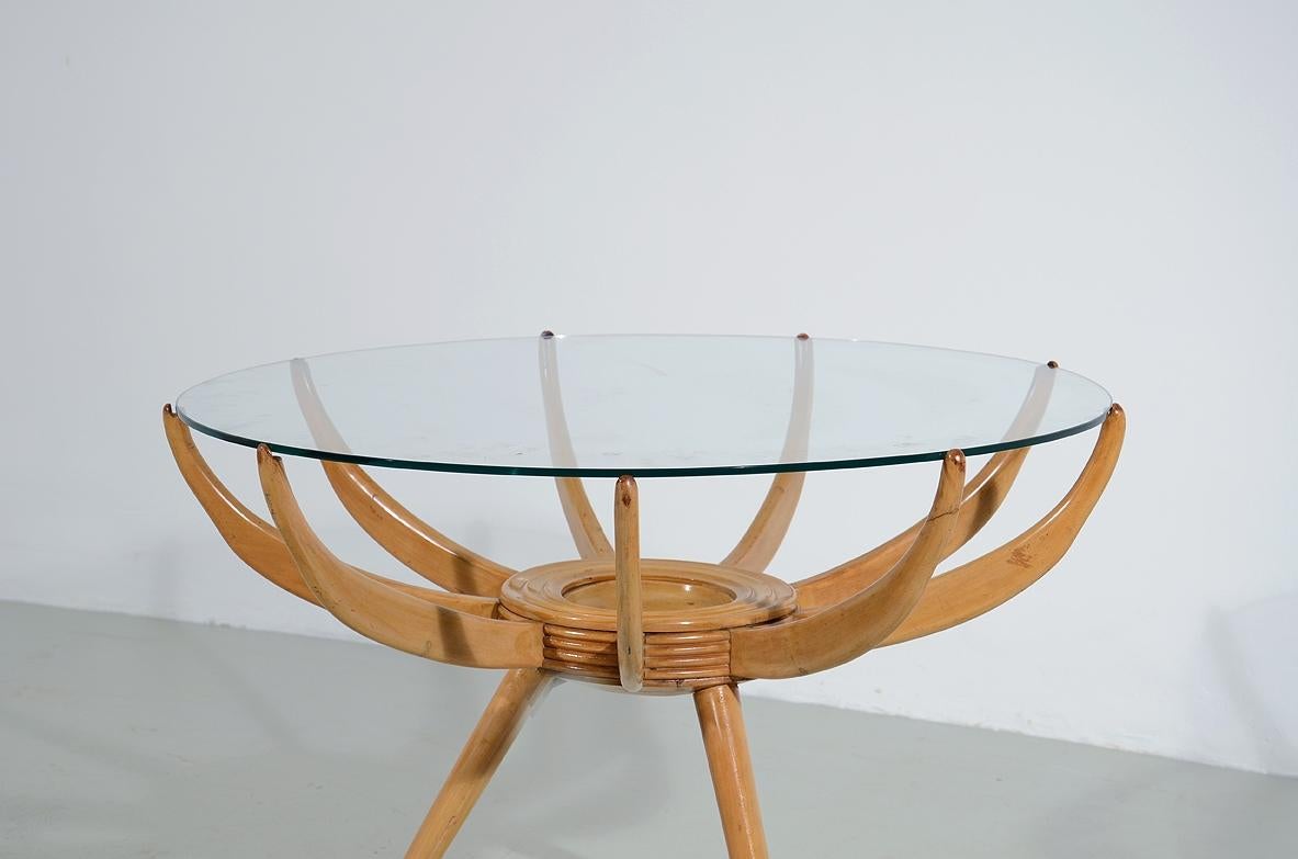 COD-1764
Carlo de Carli (1910-1999)

Coffee table in blond maple with three conical legs and nine curved arms that support a ground glass top.

1950's manufacture.

Bibl. Carlo De Carli, Editorials of the newspaper 