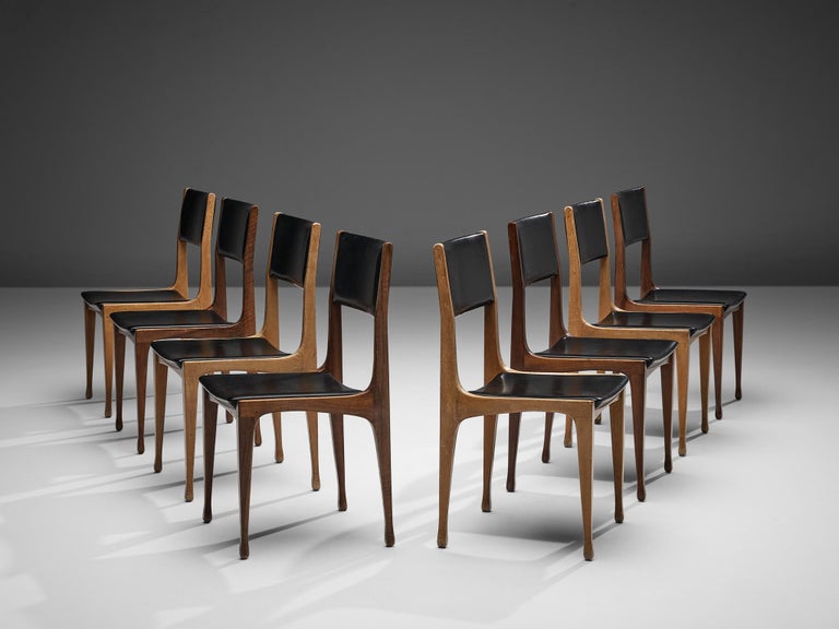 Carlo de Carli for Cassina, bicolour set of eight dining chairs model 693, beech, stained beech, faux-leather, Italy, 1958

Set of eight beautiful dining chairs by Italian designer Carlo de Carli for Cassina. This bicolour set with black leatherette