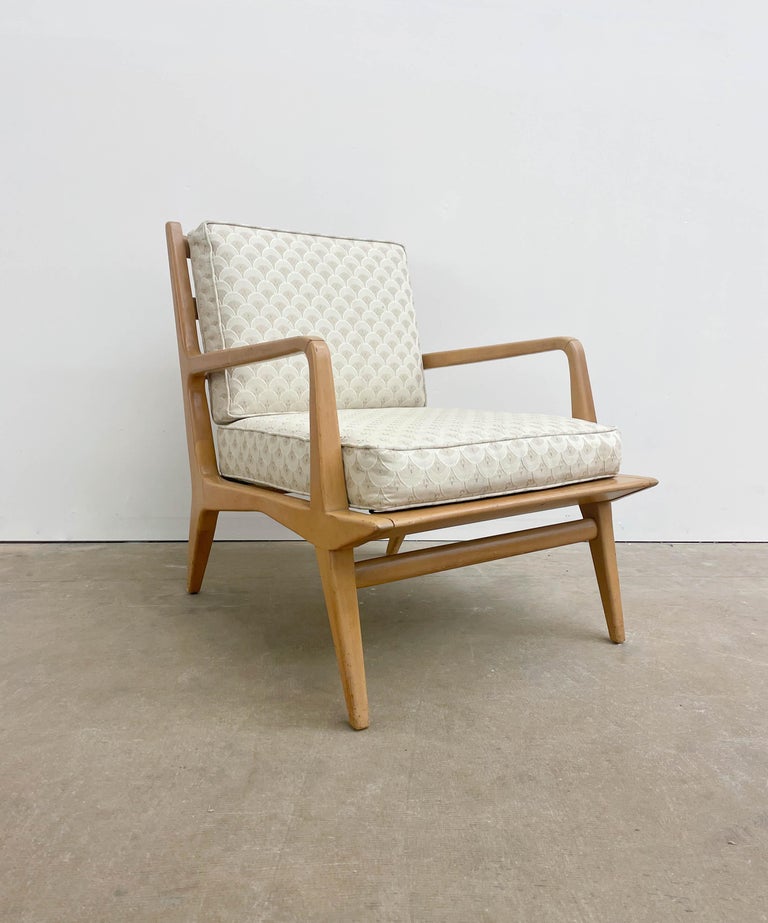 This is a Petite Lounge chair by Italian designer Carlo de Carli for M. Singer and Son's Modern collection, released in the 1950s. It offers a solid walnut frame with the original opaque/bleached finish. This is a chair for purists looking for the