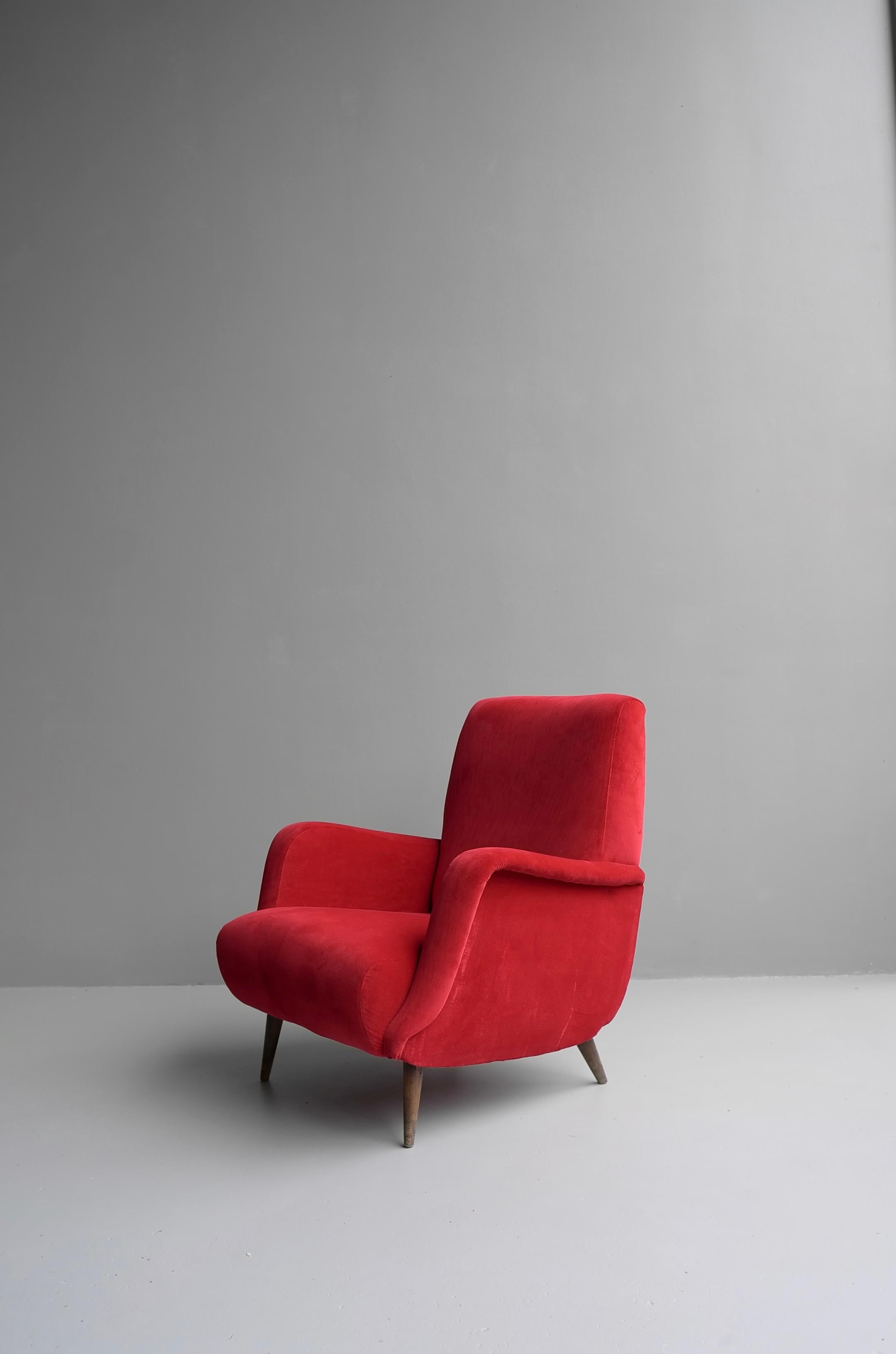 Carlo de Carli red armchair model 806 by Cassina, Italy 1955.
It is recent upholstered in a velvet style fabric. The legs are made from solid walnut.