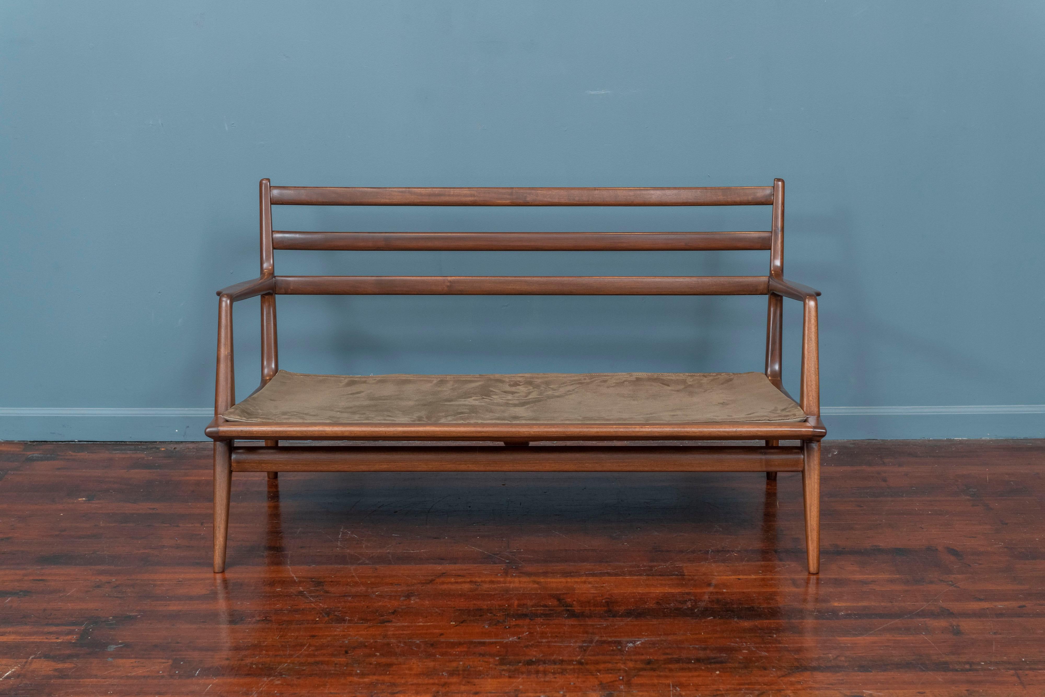 Carlo De Carli design settee or loveseat in walnut stained fruited, Italy. Classic mid-century Italian design atheistic with a sculpted frame incorporating his signature angles and finesse.
 A rare example that was purchased from the original