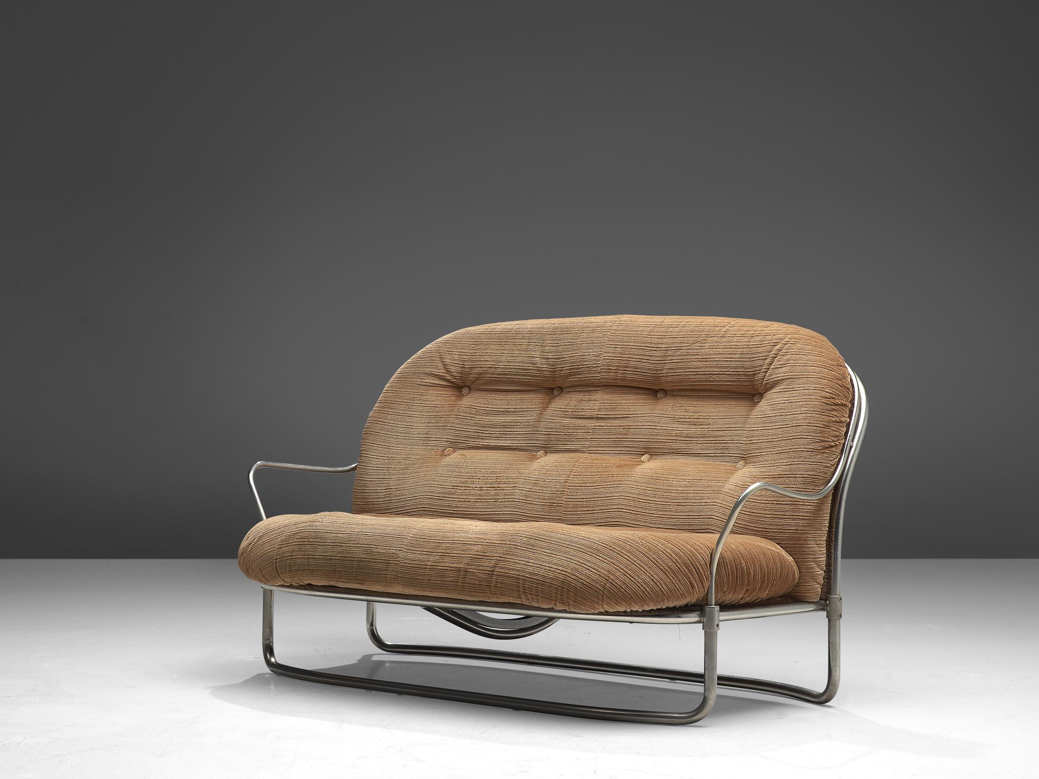 Carlo de Carli for Cinova, sofa No. 915, metal and fabric, Italy, 1969.

Elegant, tubular settee designed by Carlo de Carli in 1969 and manufactured by Cinova/Italy. The model features a curved, nickled-plated frame that holds the large, tufted