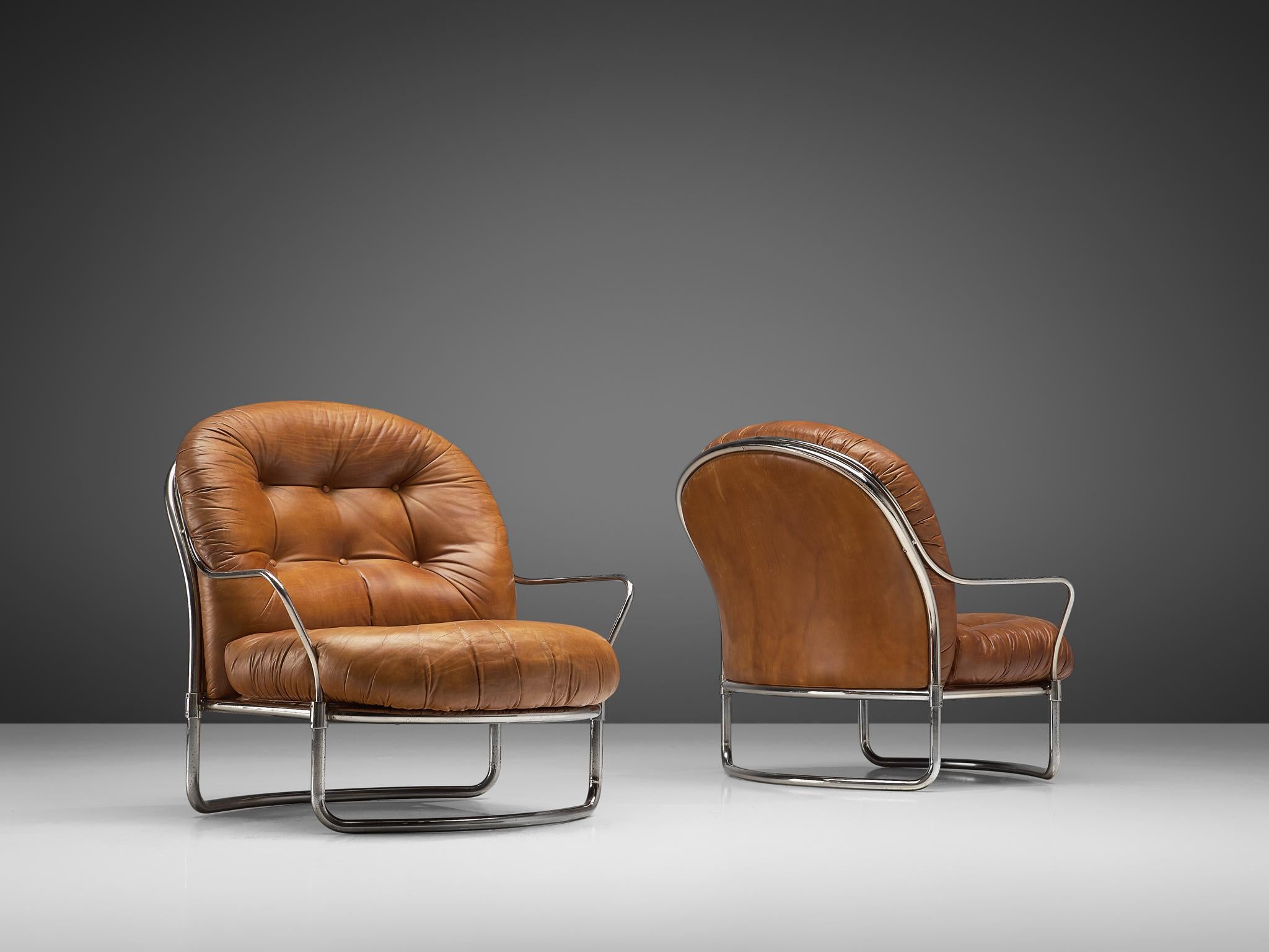 Carlo di Carli for Cinova, pair of lounge chairs No. 915, metal and leather, Italy, 1969.

Elegant, tubular armchairs designed by Carlo di Carli in 1969 and manufactured by Cinova/Italy. The model features a curved, nickled plated frame that holds