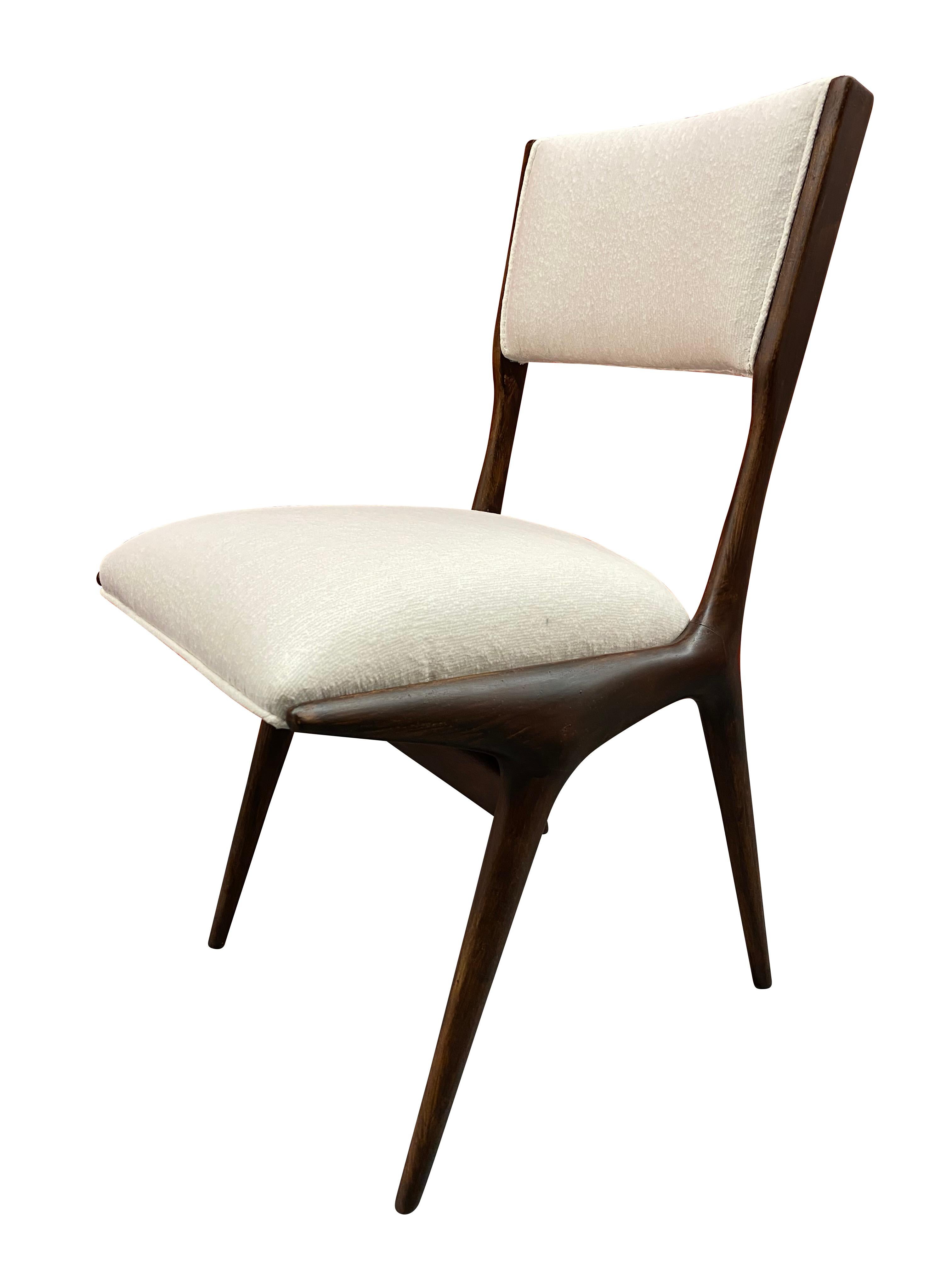 Pair of 634 chairs designed by Carlo di Carli and realized by American manufacturer Singer & Sons in 1951 and then by Cassina in 1953 onward. 

Chair has a beautiful delicate pitch upward when viewed from the profile or diagonal. 

Dark stained
