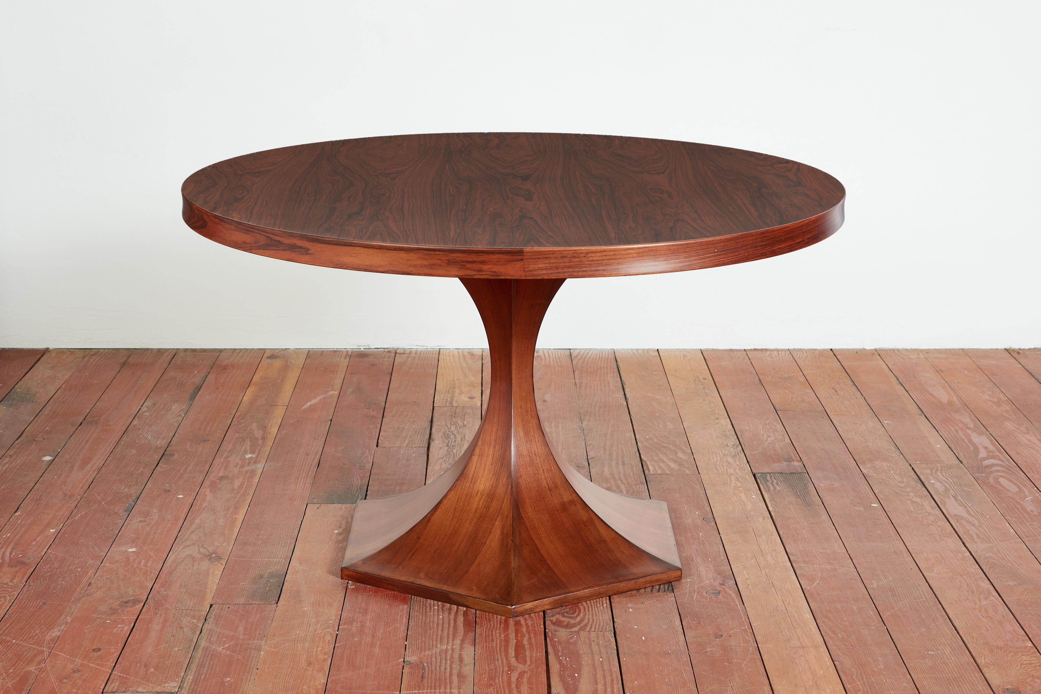 Gorgeous Round table by Carlo de Carli constructed of beautiful patina'd walnut top and sculptural base. 
Italy, 1960s

