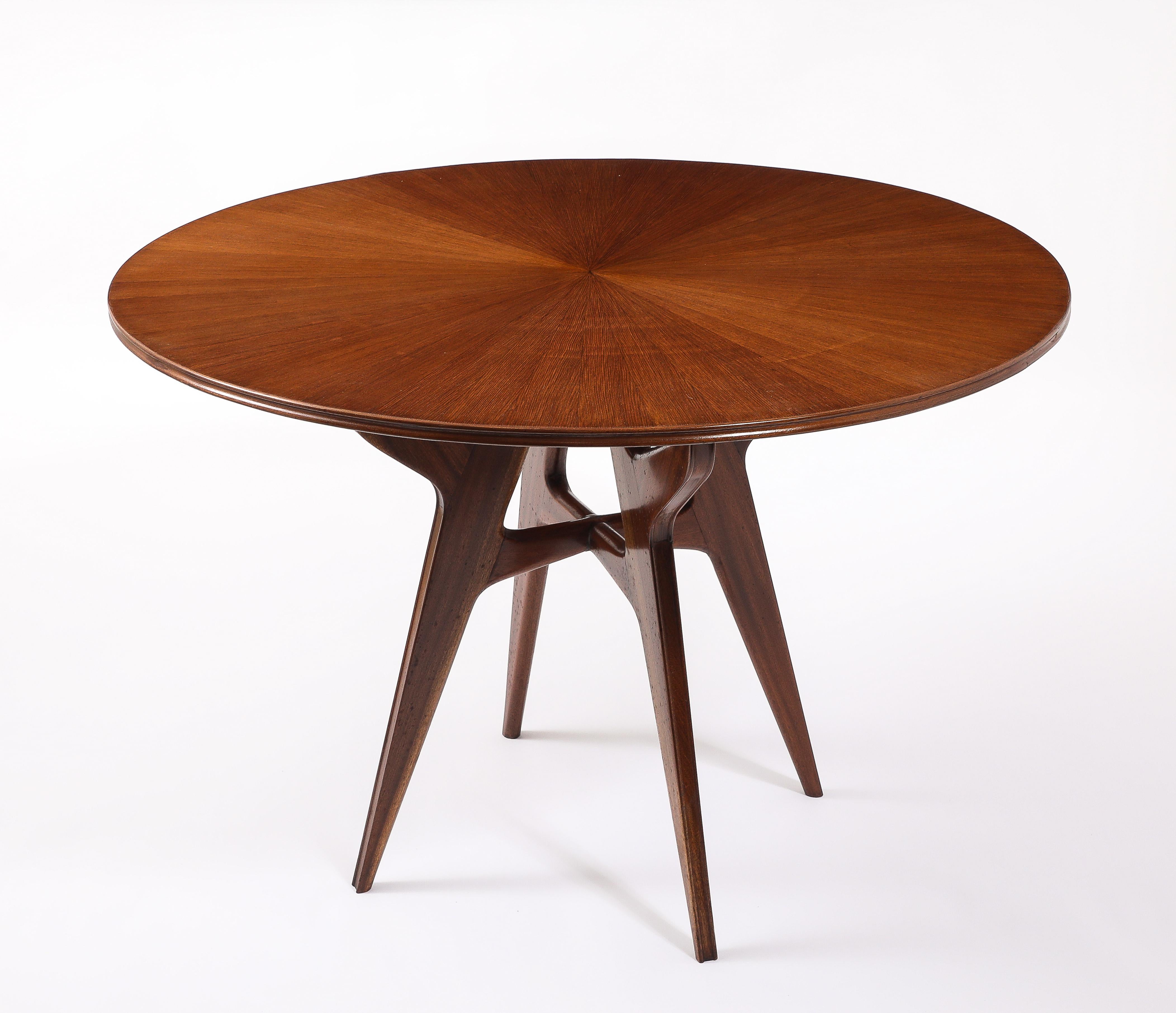 Unusual version of this model with a grooved edge both on top and legs, solid walnut legs and sun marquetry top.
