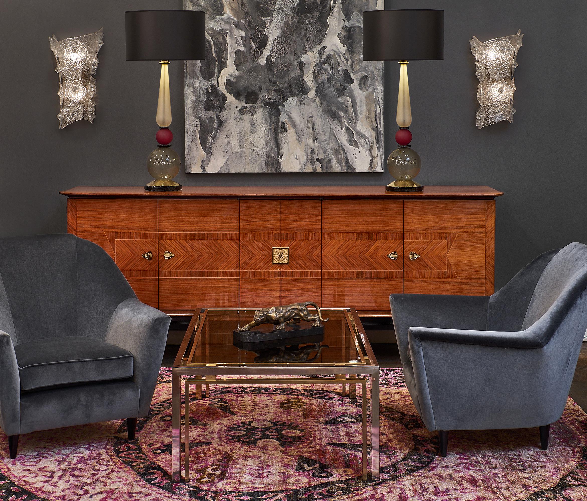 Pair of sumptuous Italian velvet armchairs by Carlo di Carli with ebonized wooden feet. This pair has been newly reupholstered with dark grey cotton velvet. The armchairs are very deep and comfortable.