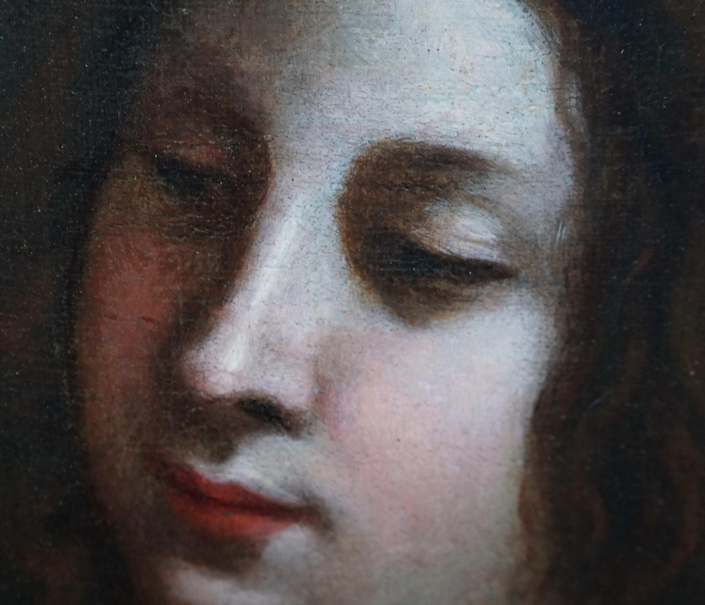 This fantastic Italian Baroque 17th century Old Master portrait oil painting is attributed to circle of Carlo Dolci. Painted circa 1685, the composition is a waist length portrait of a beautiful dark haired young woman in a blue silk dress. In one