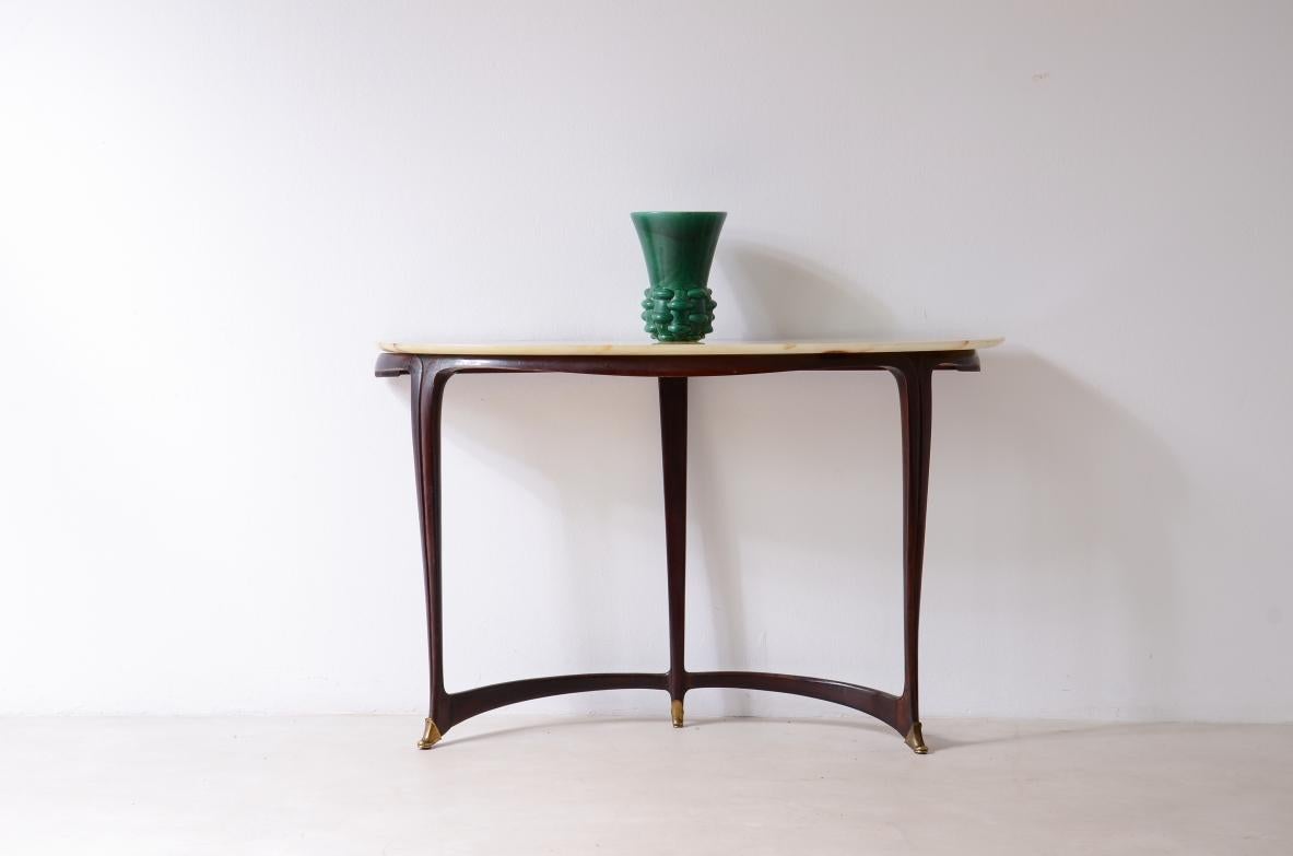 COD-S015
Carlo Enrico Rava (1903-1986)

Elegant wooden console table with mixtilinear legs and a marble top.

Bibliography: F. Grigioni,
Arredamento Gorlich 1956, fig. 304