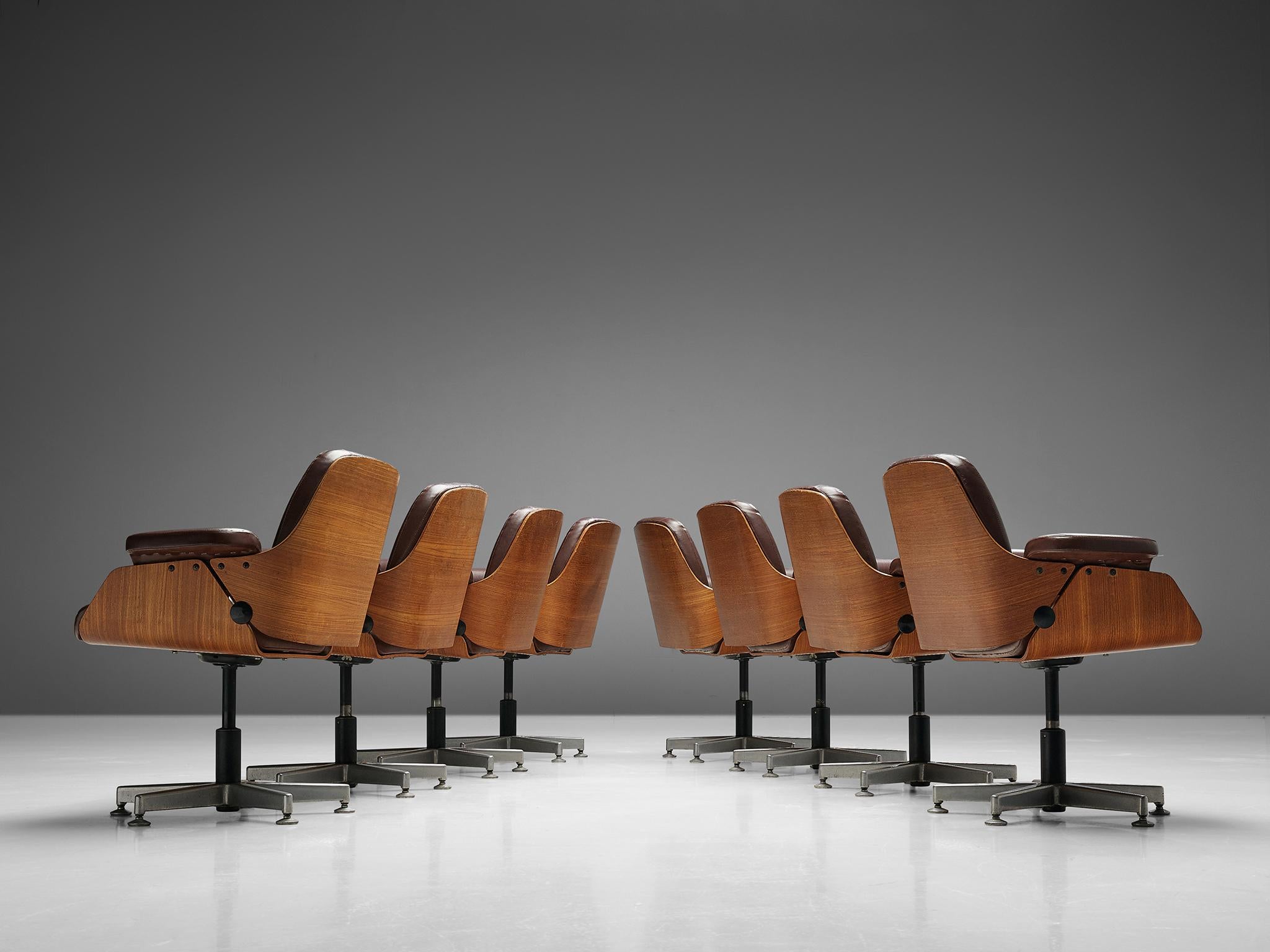 Carlo B. Fongaro for Dinamarquesa, set of eight conference chairs, teak, leather, metal, Brazil, 1975.

Set of eight office chairs designed by Carlo Fongaro and manufactured by Dinamarquesa, Brazil, 1975. These chairs have splendid wooden shell
