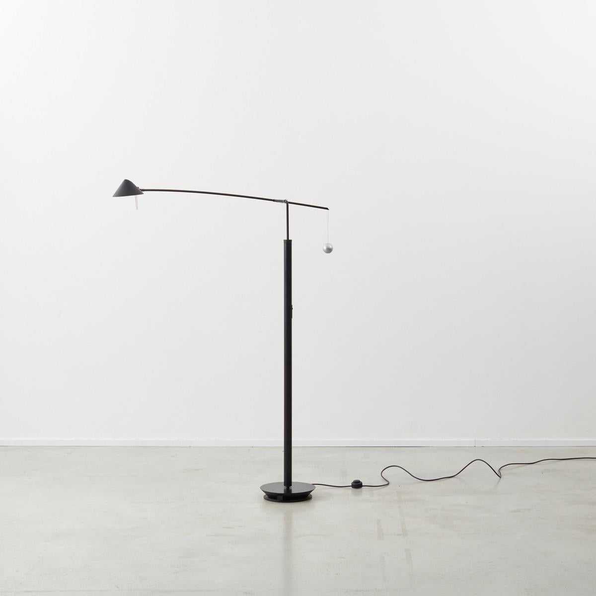 Carlo Forcolini Nestor counterbalanced halogen floor lamp with swivel arm. Produced by the prolific Italian manufacturer Artemide. In good all round condition with a repair to the hanging sphere. Rewired and tested.