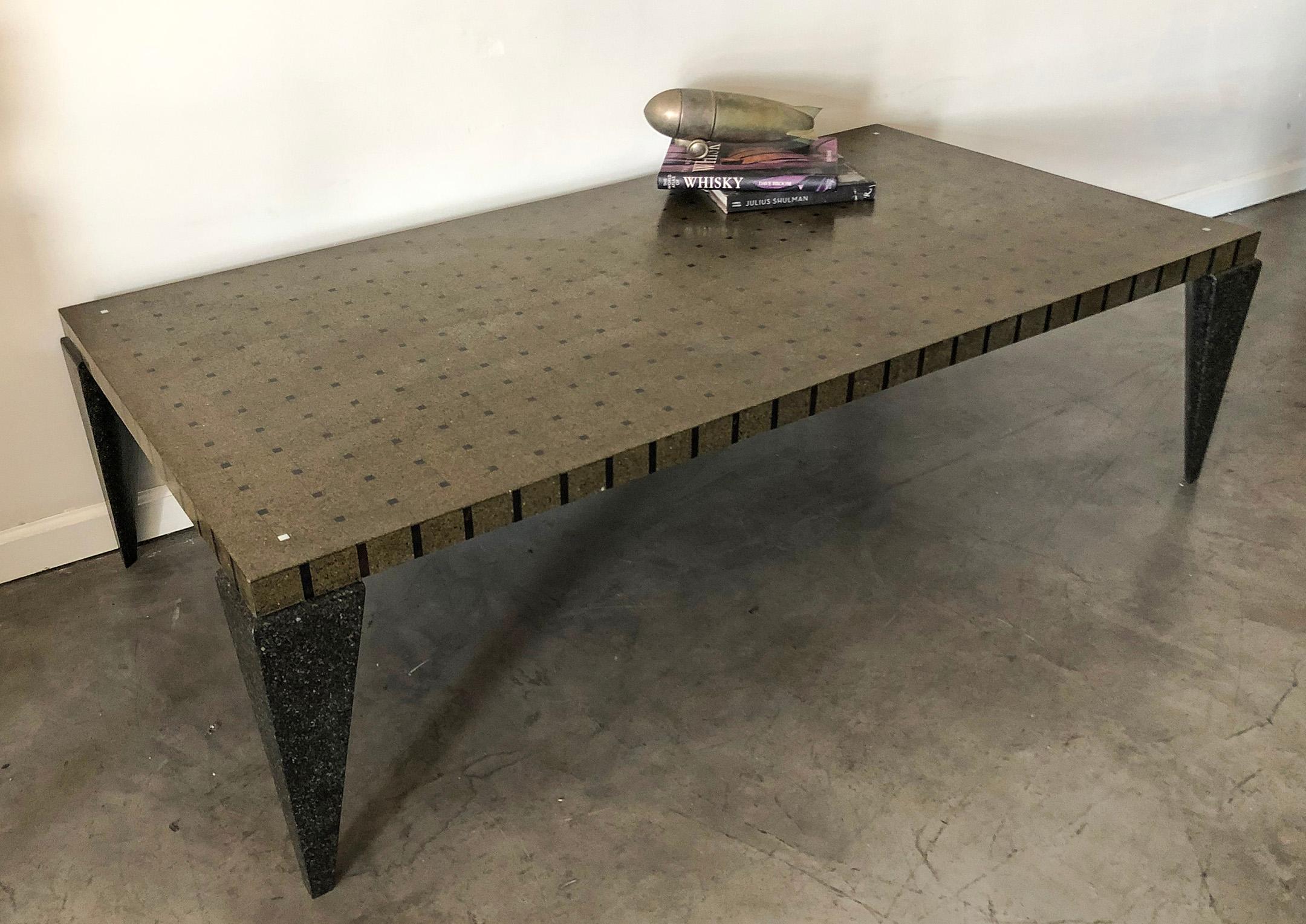 This table is stunning! With flecks of brass throughout the terrazzo of this coffee table, it brings a sparkle that balances the masculinity of this post-modern styled coffee table. Each corner of the table features black sea penshell inlay, as well