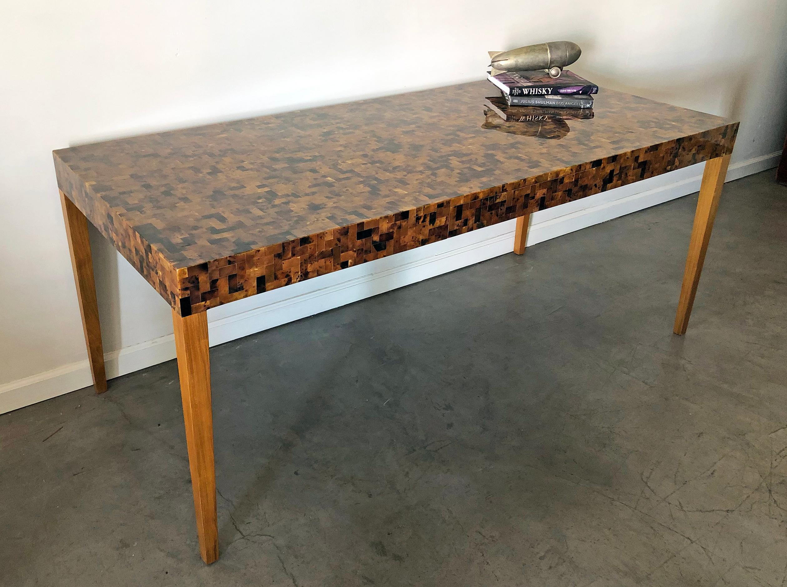 Another stunning design by Carlo Furniture, this Yellow Sea penshell dining table is just as beautiful as it is functional. With a top completely clad in penshell (which has a similar effect and properties of tortoise shell) this clean, simple