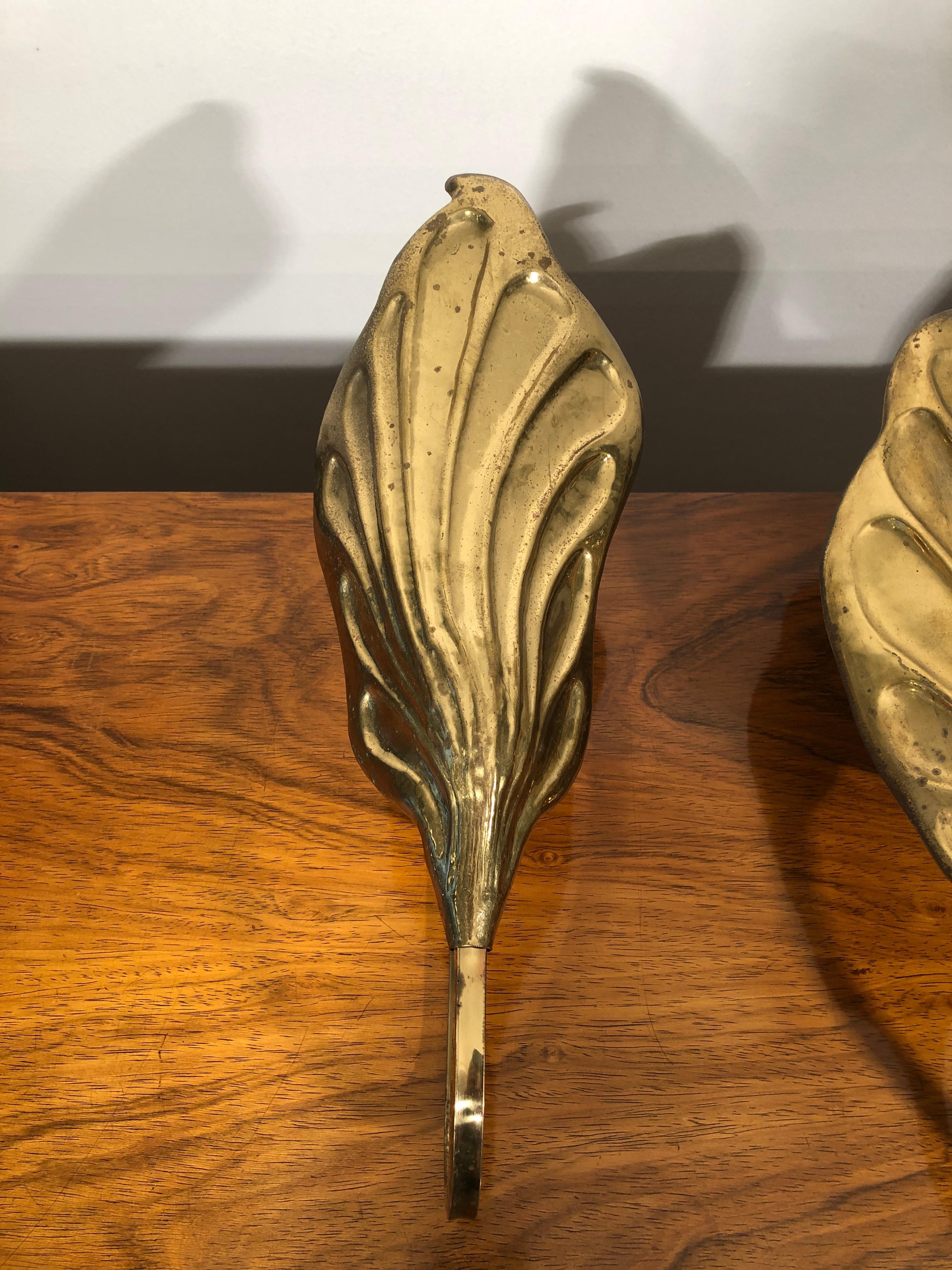 20th century Carlo Giorgi brass wall sconces, set of three. From Italy, from 1960s realized by Bottega Gadda an historic laboratory in Milan. They show wears coherent with prior use and age. We have restored them in conservative way, we will deliver