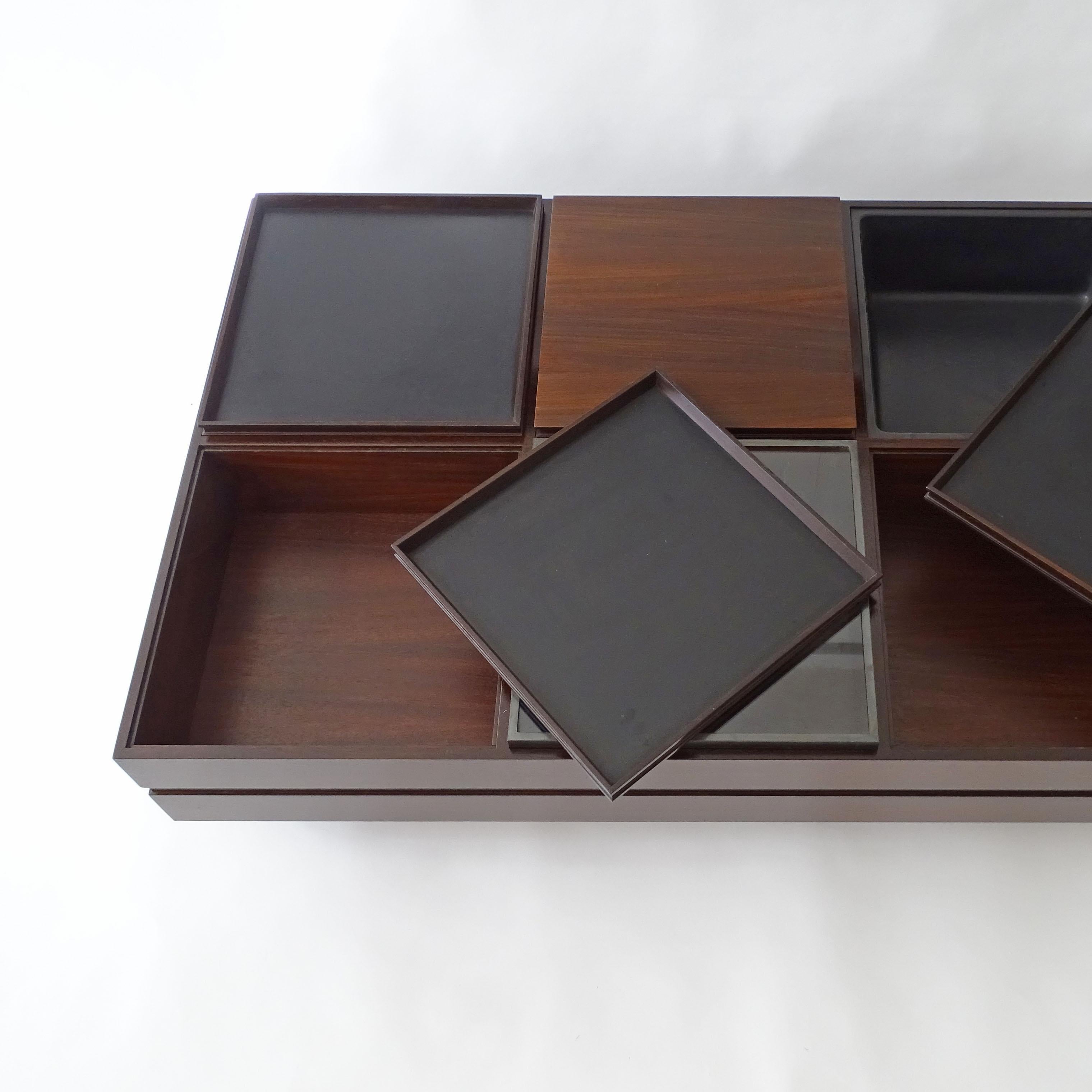 Carlo Hauner large coffee table with various compartments for Forma, Italy 1960s.
Six compartments covered with interchangeable trays, one with a plastic container made for plants.