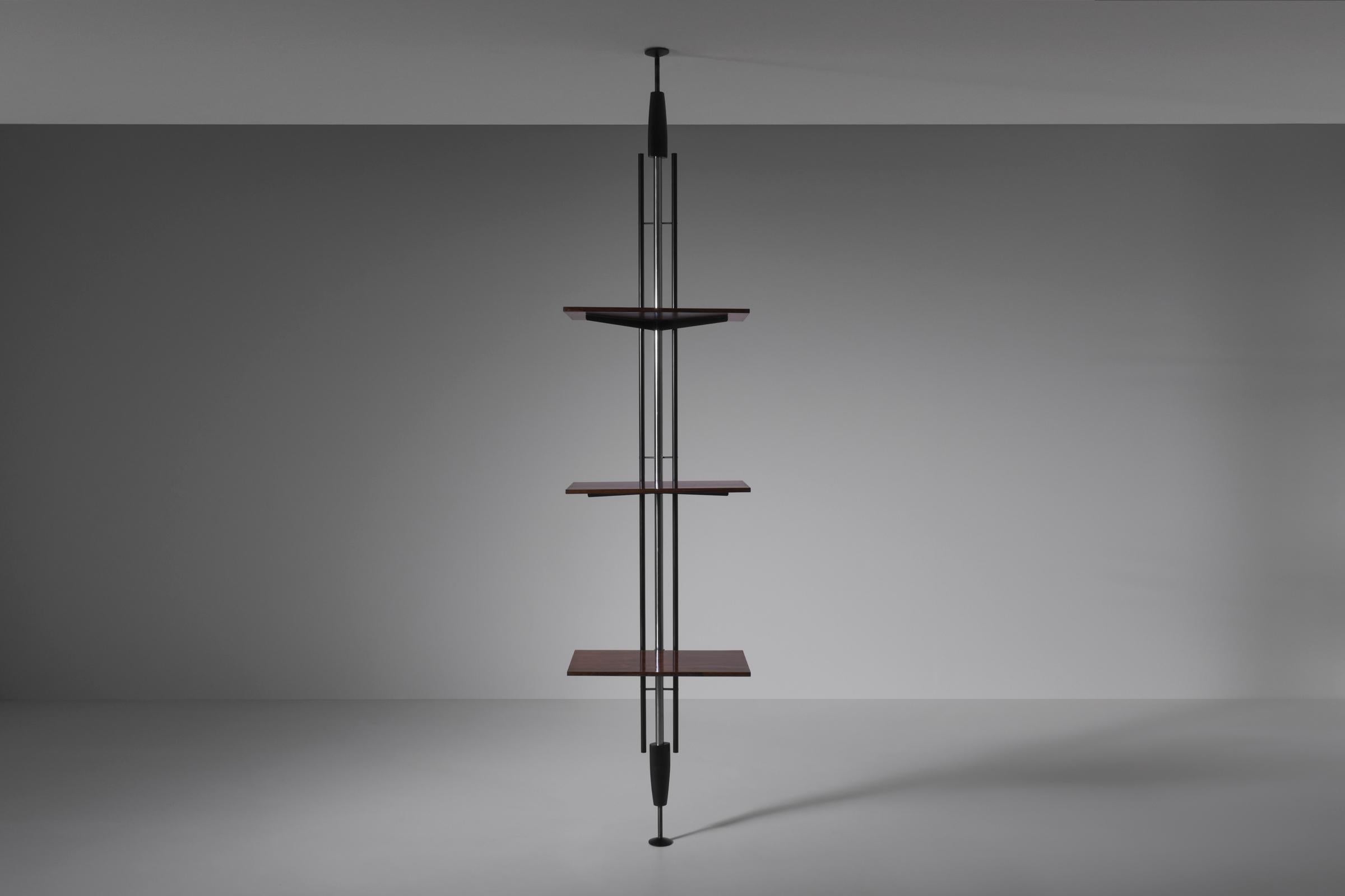 Bookshelf by Carlo Hauner & Martin Eisler for Forma, 1960. Sophisticated minimal design consisting of a large chromed metal stem, black lacquered metal elements and fine Rosewood shelves. The Rosewood shelves can be rearranged in height. Beautiful