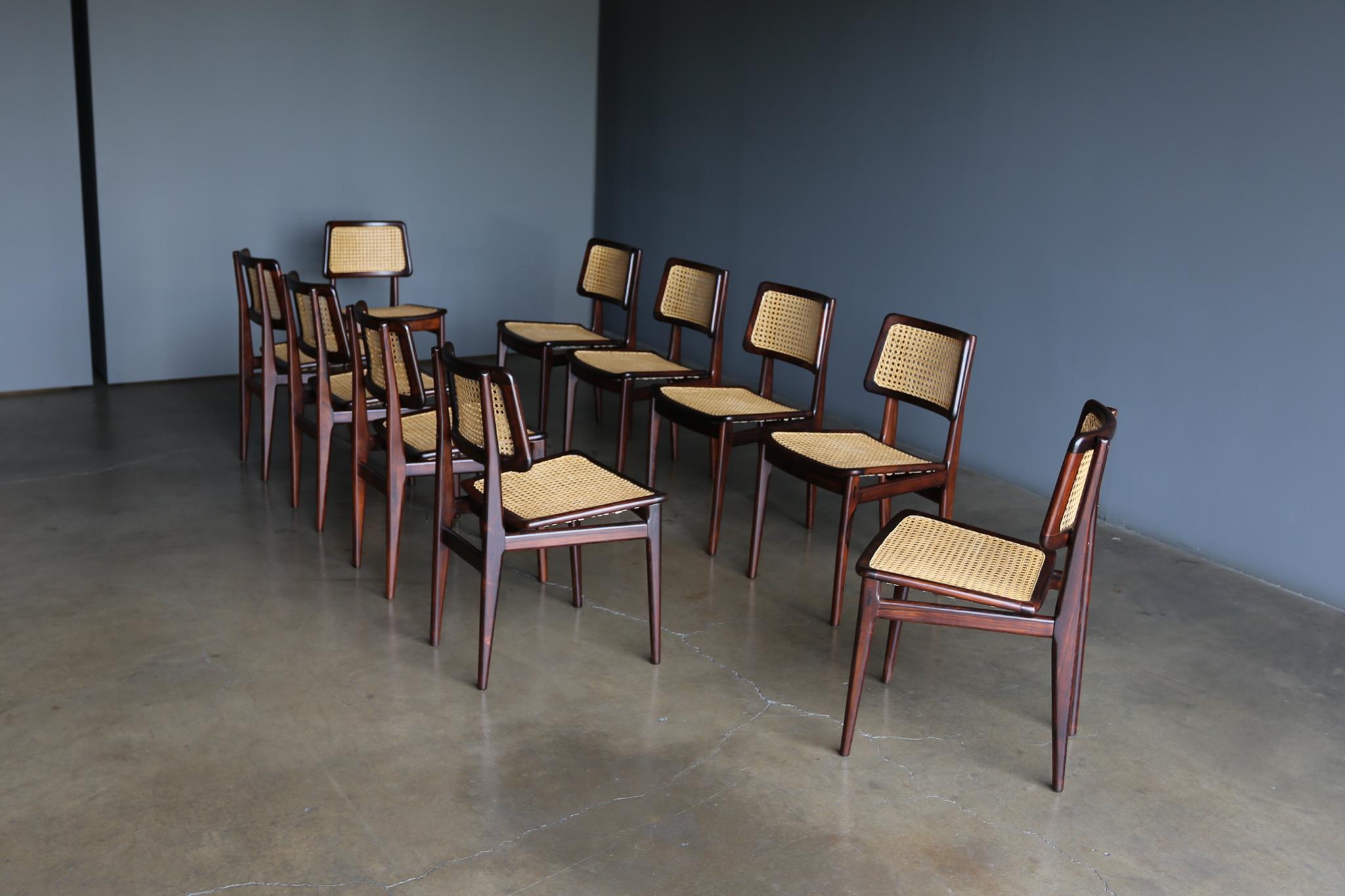Carlo Hauner & Martin Eisler set of 10 dining chairs for FORMA, Brazil, 1952 - 1958. Highly figured Solid cabiúna wood with natural cane. This set has been expertly restored.