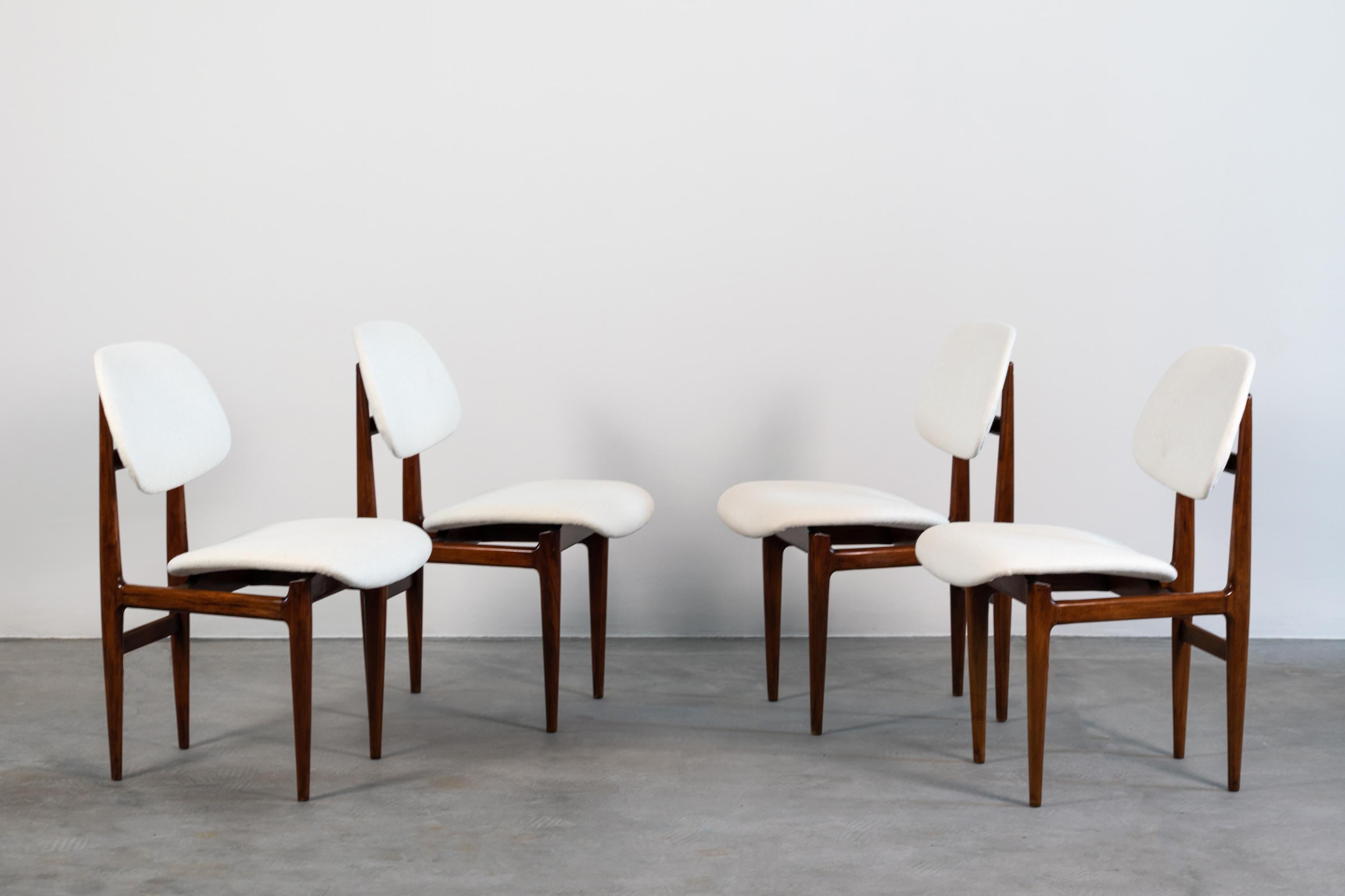 Set of four chairs designed by Carlo Hauner & Martin Eisler for Forma (Mompiano Brescia, 1960).
These chairs present a walnut wood structure upholstered in a beautiful ivory fabric.
   
