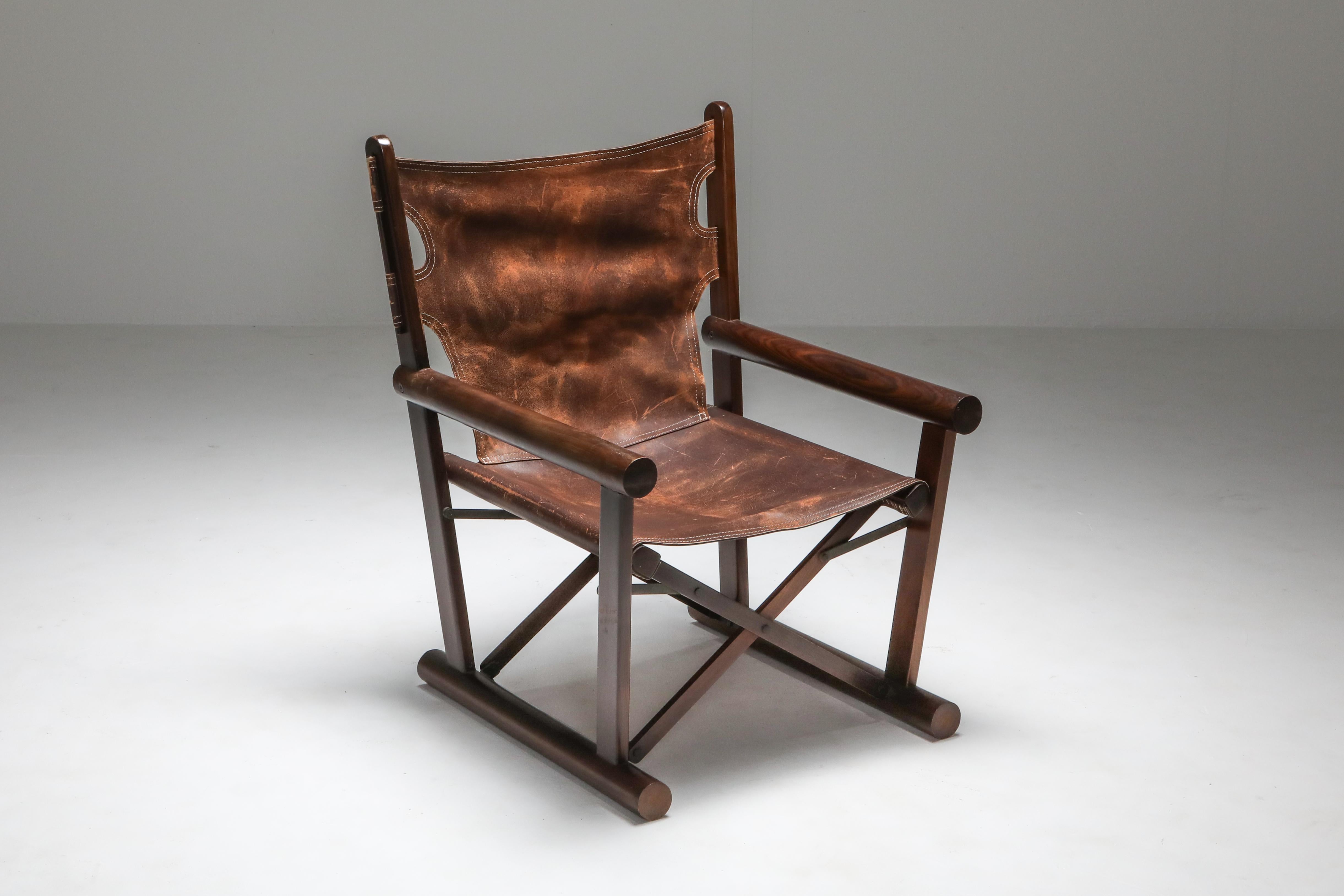 Brazilian modern chair by Carlo Hauner, Oca, 1960s

This folding chair is iconic for Brazilian Mid-Century Modern, from the 1960s. This particular piece is executed with a jacaranda frame and brown leather sling seat. 

   