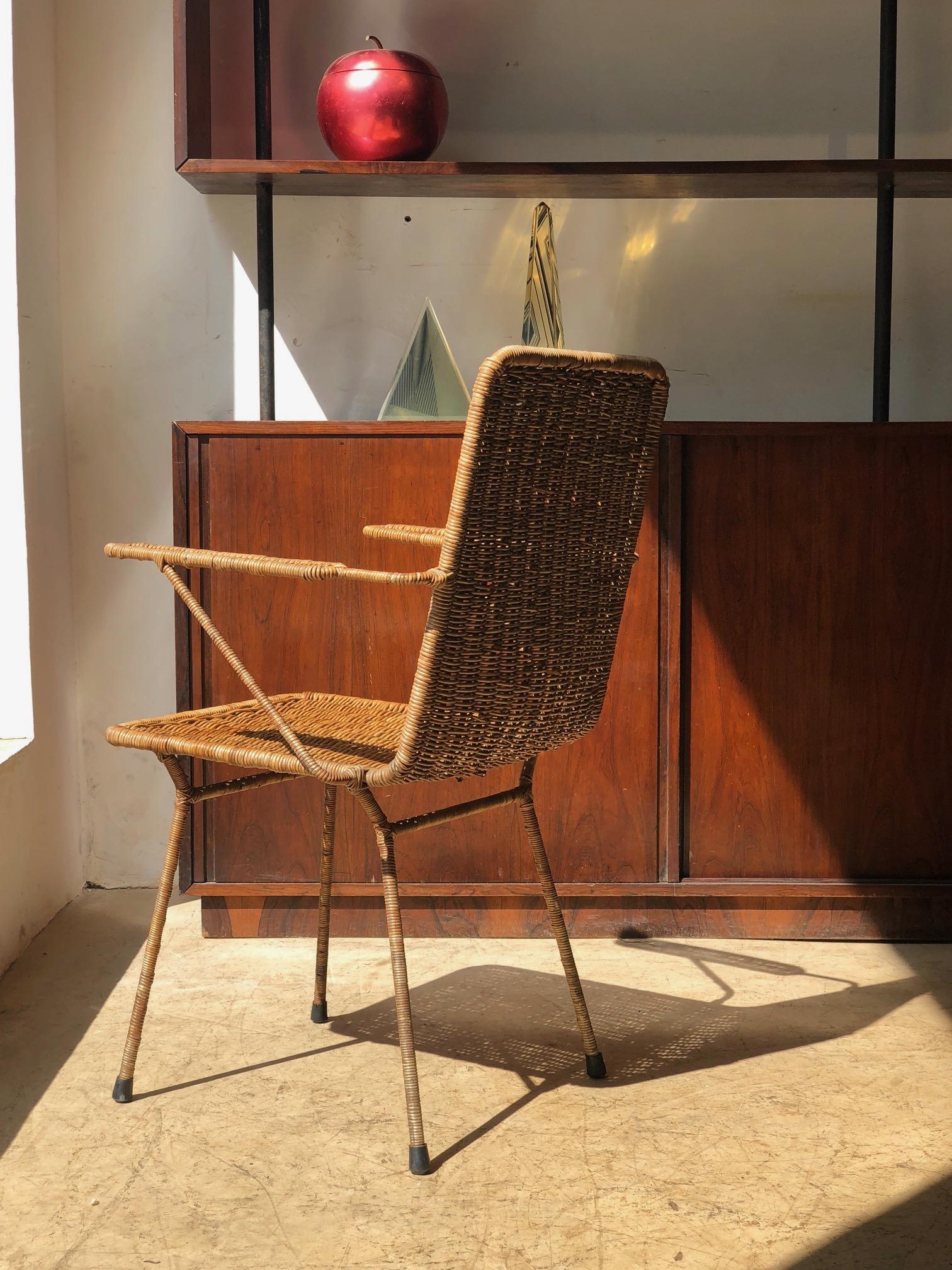 Pair of armchairs with iron structure and cane covering, designed by the Brazilian modern designer Carlo Hauner in the 1950s.