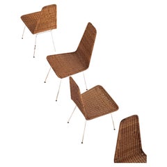 Carlo Hauner. Suite de 4 chaises en rotin, vers 1950. Métal et rotin