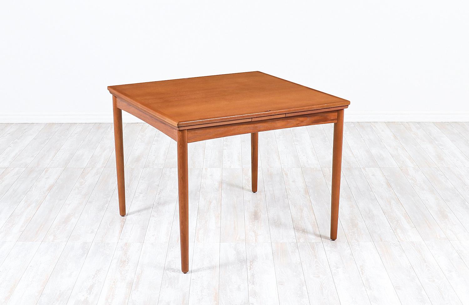Carlo Jensen flip-top expanding dining / game table for Hundevad & Co.

Dimensions:
28in H x 35.25in, 62.75in W x 35.25in D
2x extension leaves 13.75in.