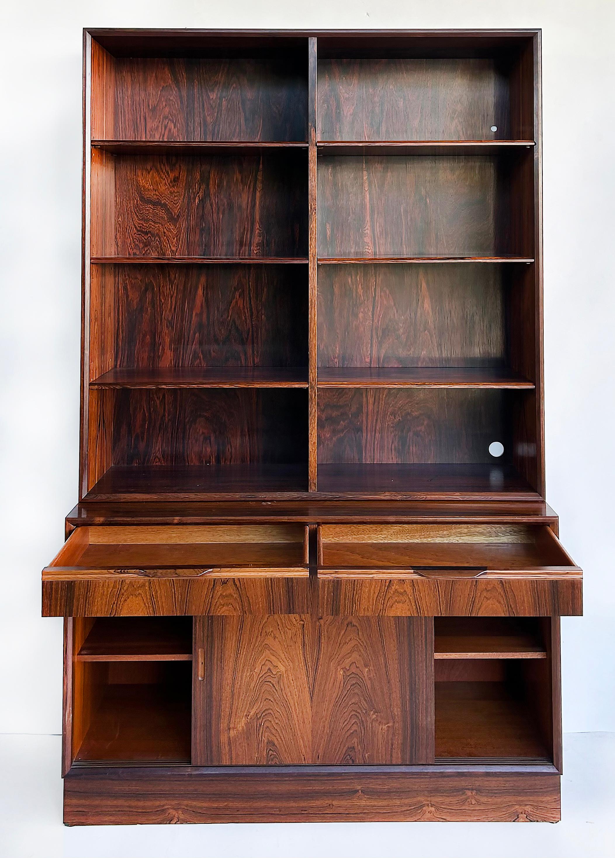 Carlo Jensen Poul Hundevad Danish Rosewood Bookcases, Pair Avaialbe 


Offered for sale individually are 2 Danish Modern rosewood bookcases by Carlo Jensen for Poul Hundevad and Hundevad & Co. They were made in Denmark circa 1970. Each bookcase is