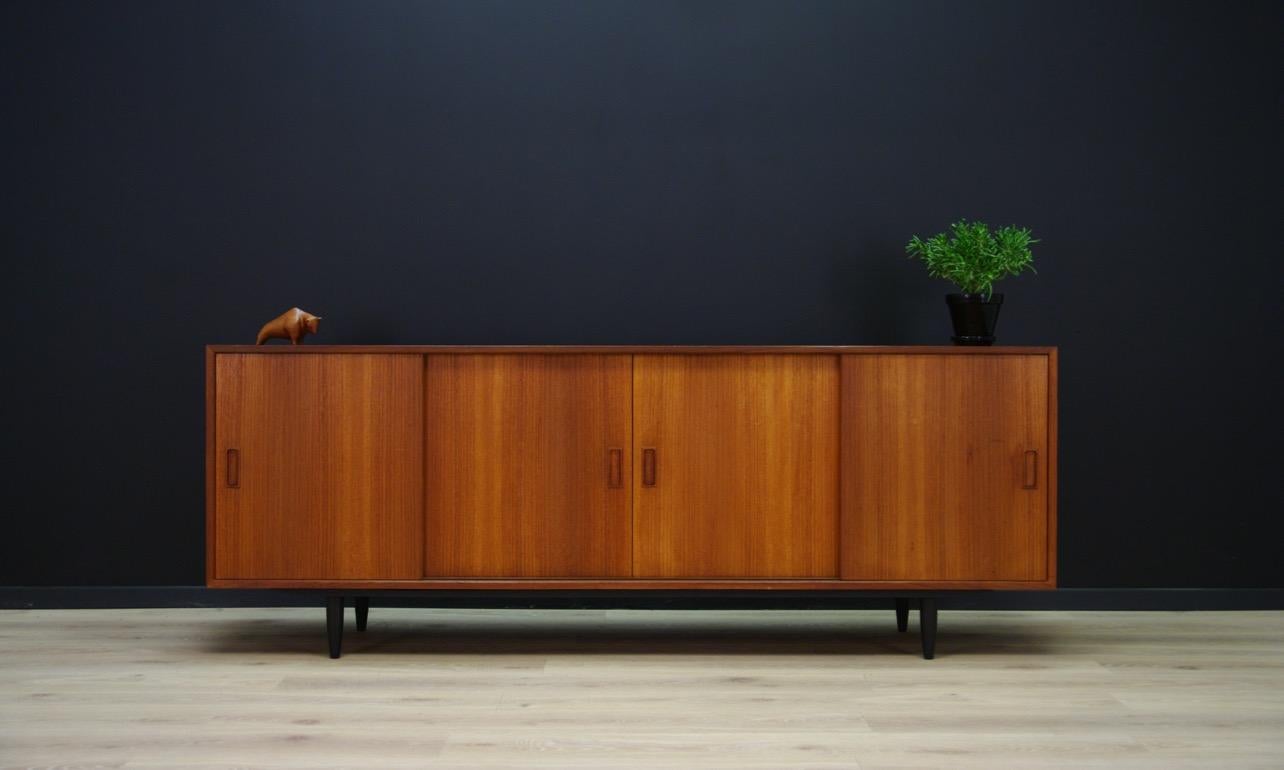 Stylish sideboard, Danish minimalism from the 1960s and 1970s, a Classic form with sliding doors designed by Carlo Jensen, produced by Westergaard Møbelfabrik. Inside practical shelves. Sideboard veneered with teak. Preserved in good condition