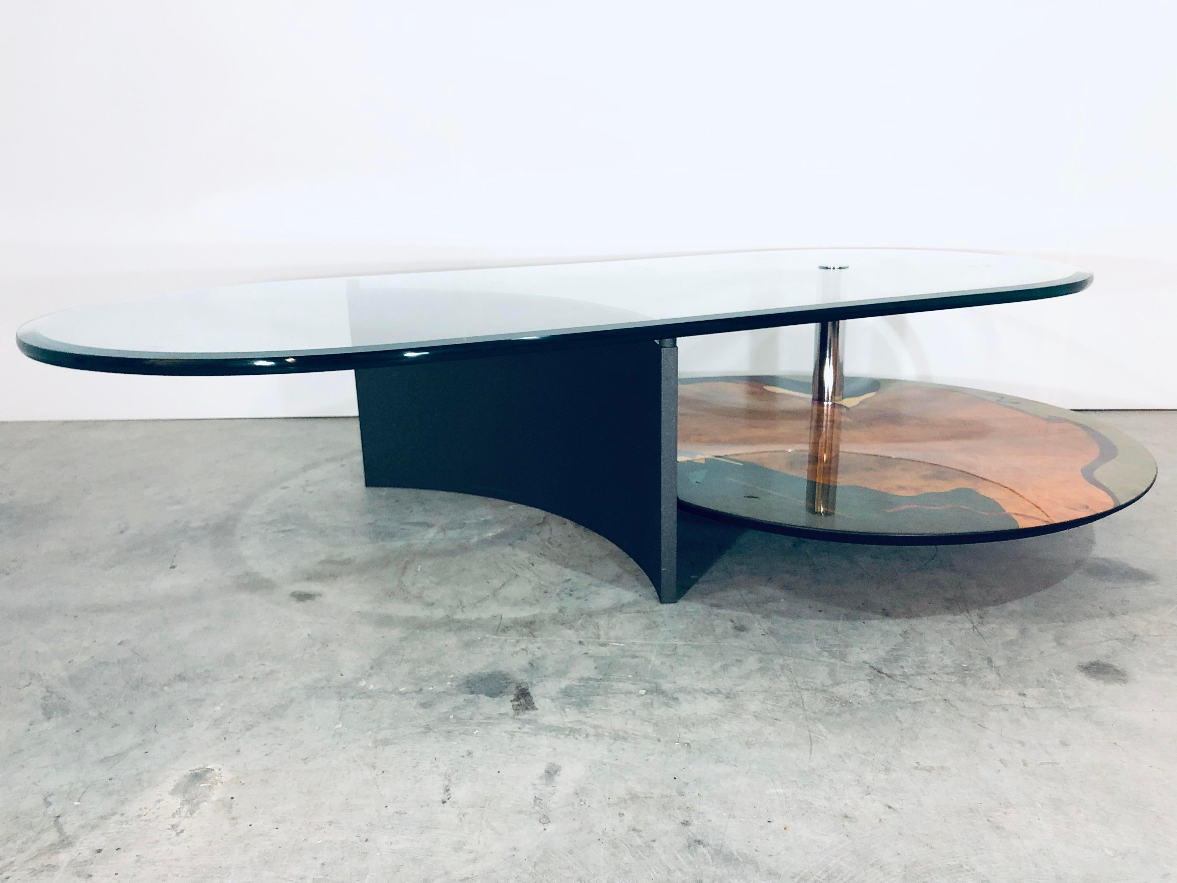 Unique coffee table with geometric burl wood art base and 3/4” cantilevered glass top with 1” bevel designed and produced by Carlo Malnati, Italy. Signed on wood base near chrome tube.

Glass Dirmensions:
W28” D60”