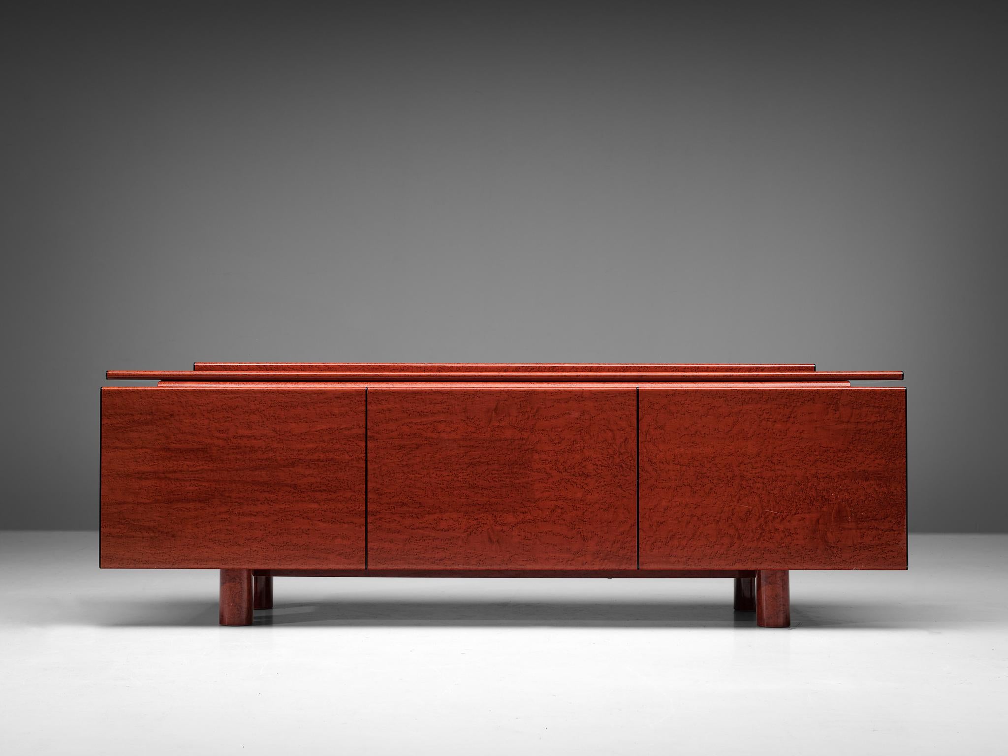 Carlo Marelli and Massimo Molteni for Guiseppe Borghi & Figli, sideboard, model 'Tula', red stained birdseye maple, glass, fine leather, Italy, 1980s

This eccentric sideboard has a strong artistic look and hits the border between art and furniture.