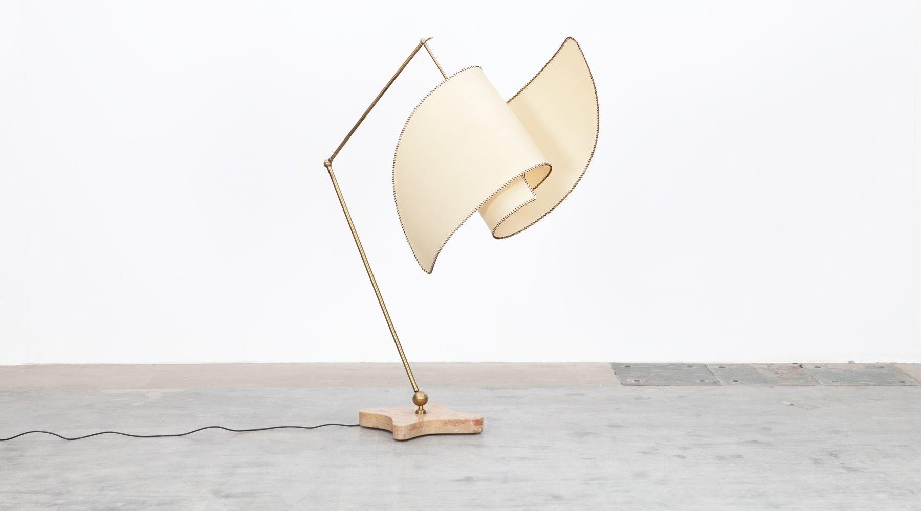 The design for this adjustable floor lamp was created by Carlo Mollino in 1947. This re-edition was made in 2016 by Galleria Colombari. Parchment shade supported by brass arm on polished marble base. The lamp is able to swivel 360 degrees by