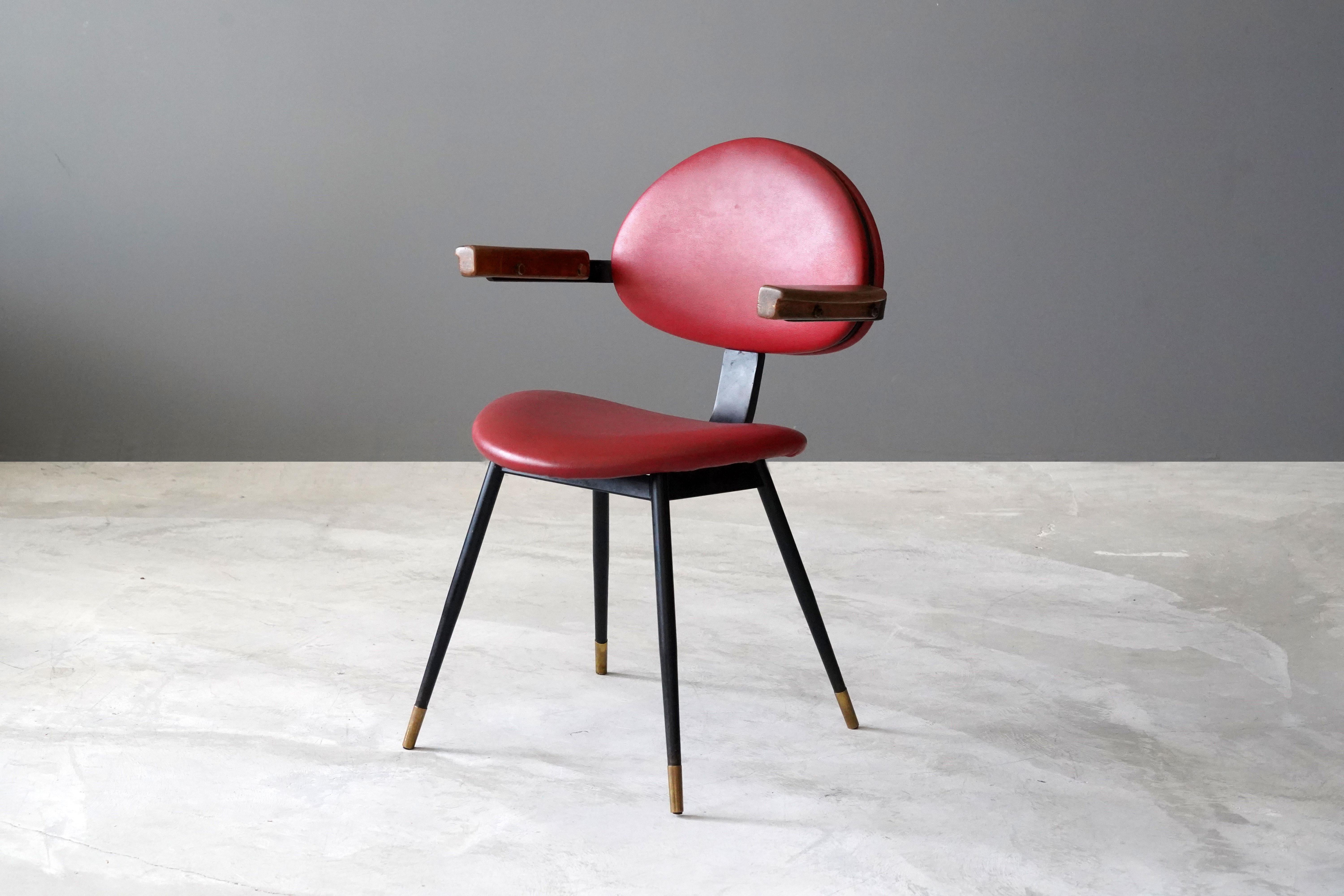 A rare side chair designed by Carlo Mollino for the Lutrario ballroom, Turin, Italy, in 1959. In painted tubular iron, painted iron, Resinflex, oak. Produced by Doro.

Fulvio Ferrari, the leading expert on Carlo Mollino, described the Lutrario