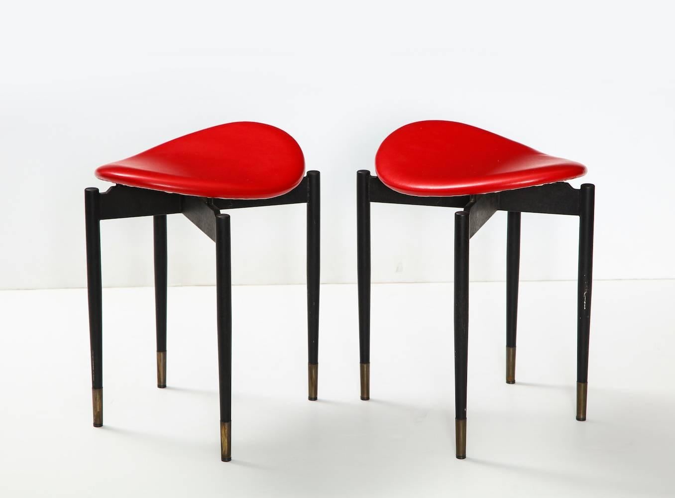 Rare pair of stools by Carlo Mollino.
Enameled steel legs with brass tips and red vinyl seats. From Mollino's commission at Lutrario Hall, Turin. 
Literature: Carlo Mollino: Interni in Piano-Sequenza, De Giorgi, ppg. 146-147 Carlo Mollino,
