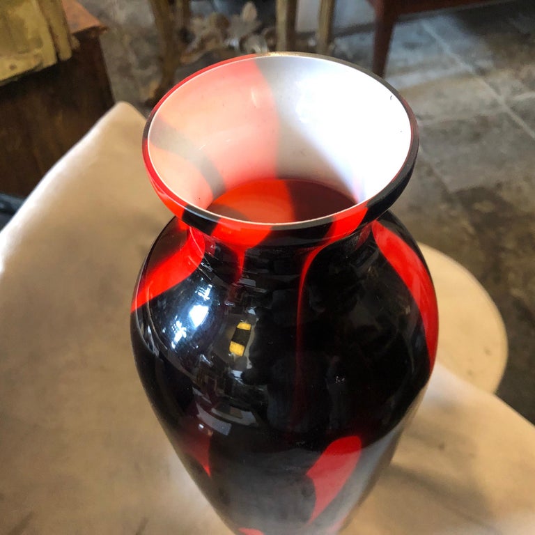 A red and black opaline glass vase made in Italy in the 1970s, it's in perfect conditions. Amazing colors and design.