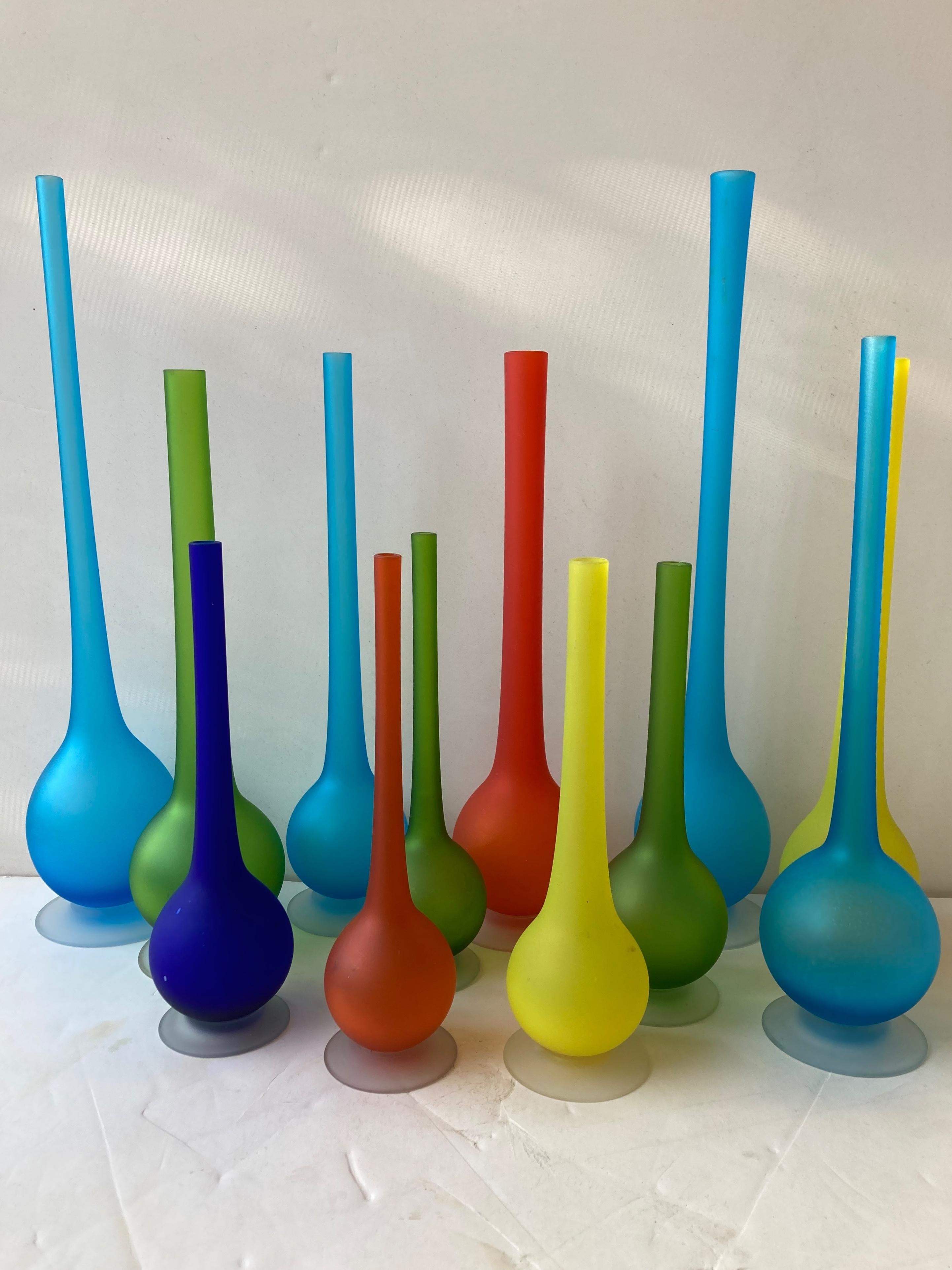 Beautiful, colorful collection of 12 satin pencil neck shape vases designed by Il maestro Carlo Moretti.

Assorted sizes from 10 to 18 inches high. 