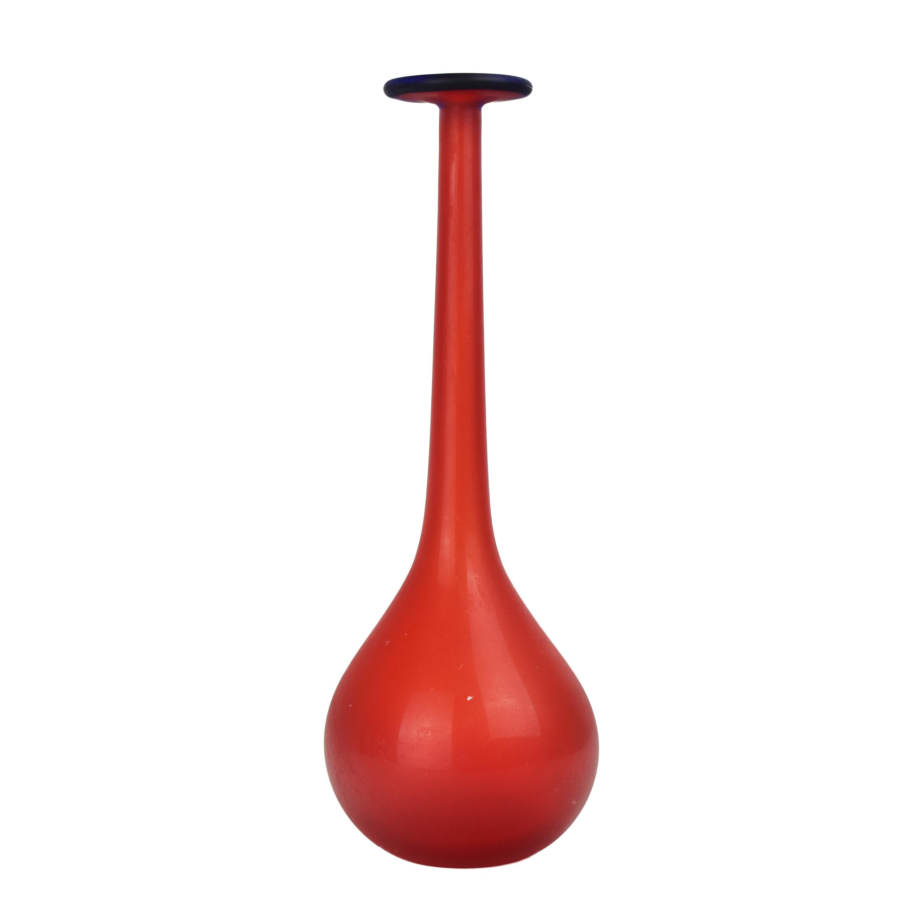 The vintage Carlo Moretti long stem soliflor vase is a striking and elegant piece of art glass that showcases the mastery of Italian glassmaker Carlo Moretti. This vase embodies the exquisite craftsmanship and artistic sensibility for which