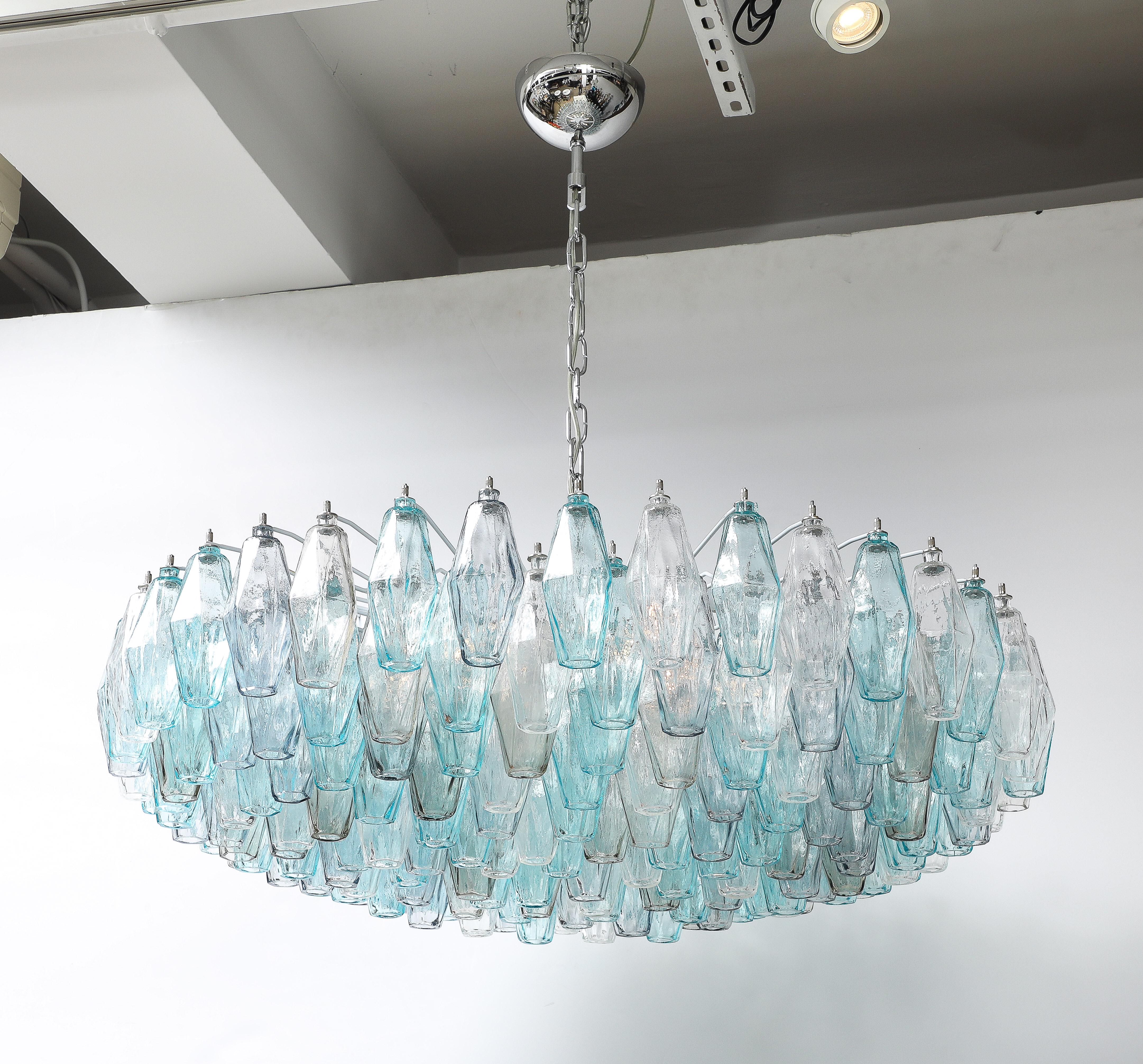 Timeless Mid Century Modern hand blown Murano glass chandelier with jewel toned hand blown glass elements in aquamarine, pale amethyst, clear and smoked topaz. Wired for use in USA, chandelier has 6 light sources.
Chandelier body measures 14 inches